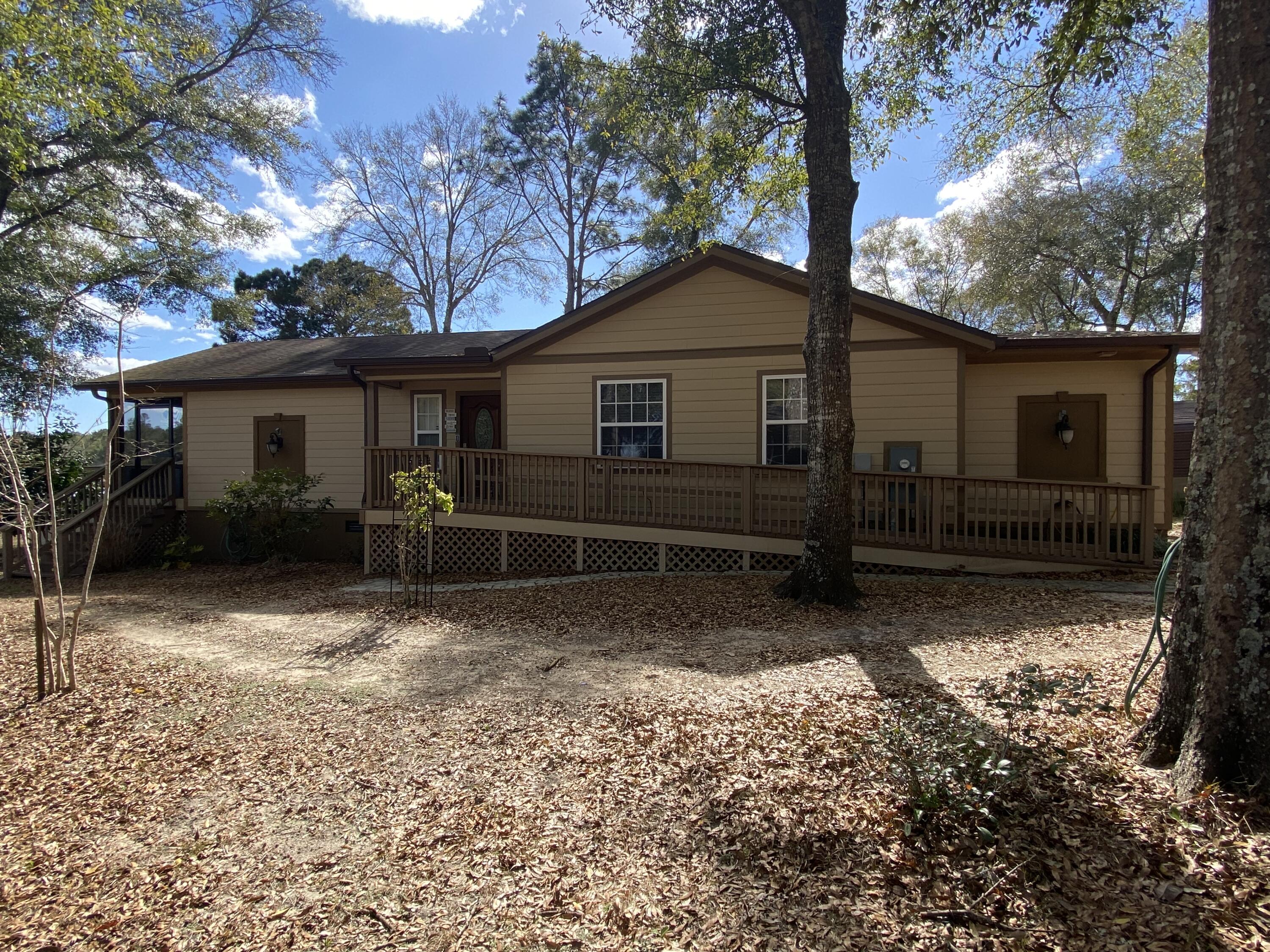 Waterfront home on Juniper Lake built in 2015 only 3 miles north of DeFuniak Springs. As you enter the home you have a raised ceiling  and fireplace in the living room/dining room combo with  a galley kitchen with lots of cabinets.  Home has 3 bedrooms and 3 baths.  On your left a  12'x25' screened porch off the living room which is great for entertaining and water view.  Master bedroom has an office/bonus room and master bath.  Second and largest bath has a 6' jacuzzi tub and walk-in closet and double vanities.   Third bath/hall bath is a full bath also.  Central air/heat with a back-up wall gas unit.  Sitting on your back screened porch you can enjoy the sunrises with that first cup of coffee.