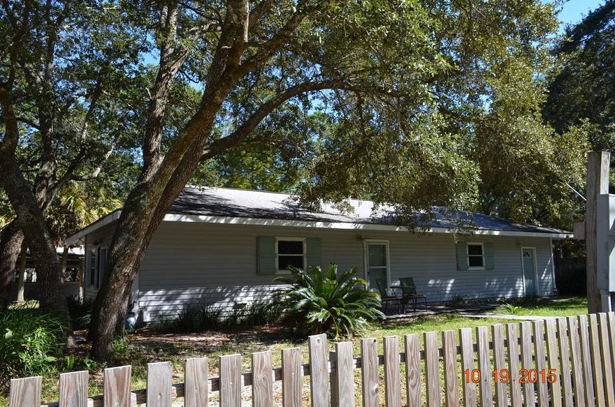 Canal front home, only a short distance to the bay with large fenced yard on 2 lots. This is a great home, freshly painted and spotless!! A large kitchen featuring 14 foot bar and overhead lighting. The house has ceramic tile throughout, new ceiling fans, storm doors, hurricane shutters. A weight/exercise, home office or recreation room has a separate entrance and a separate storage building. Outdoors there is an irrigation system, triple terrace, sea wall, boathouse, slip, dock & work shed. Playground equipment does not convey. Property to convey AS IS with right to inspect. All dimensions are approximate and should be verified to the Buyer's satisfaction.