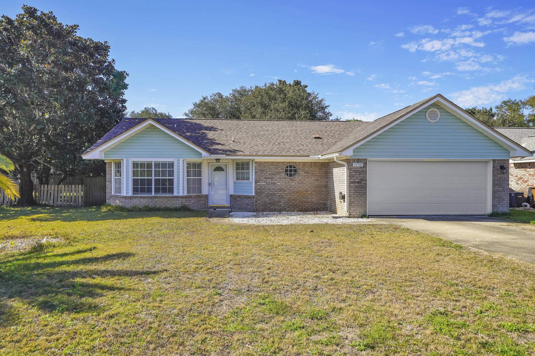 Charming 3 bedroom 2 bath home in Legend Cove Subdivision on Southside of Hwy 98, with water access to the Santa Sound. You'll be impressed with this home, featuring granite countertops, wood flooring, fireplace and an awesome Florida room making this home feel much larger. New roof in 2017.Home is walking distance to the neighborhood water access. Grab your kayak or Stand Up Paddle board and enjoy our beautiful Santa Rosa Sound. The large back yard makes for a great place to add a swing set or play ball with the kids. Come by and check out this cute home. Washer and Dryer will convey