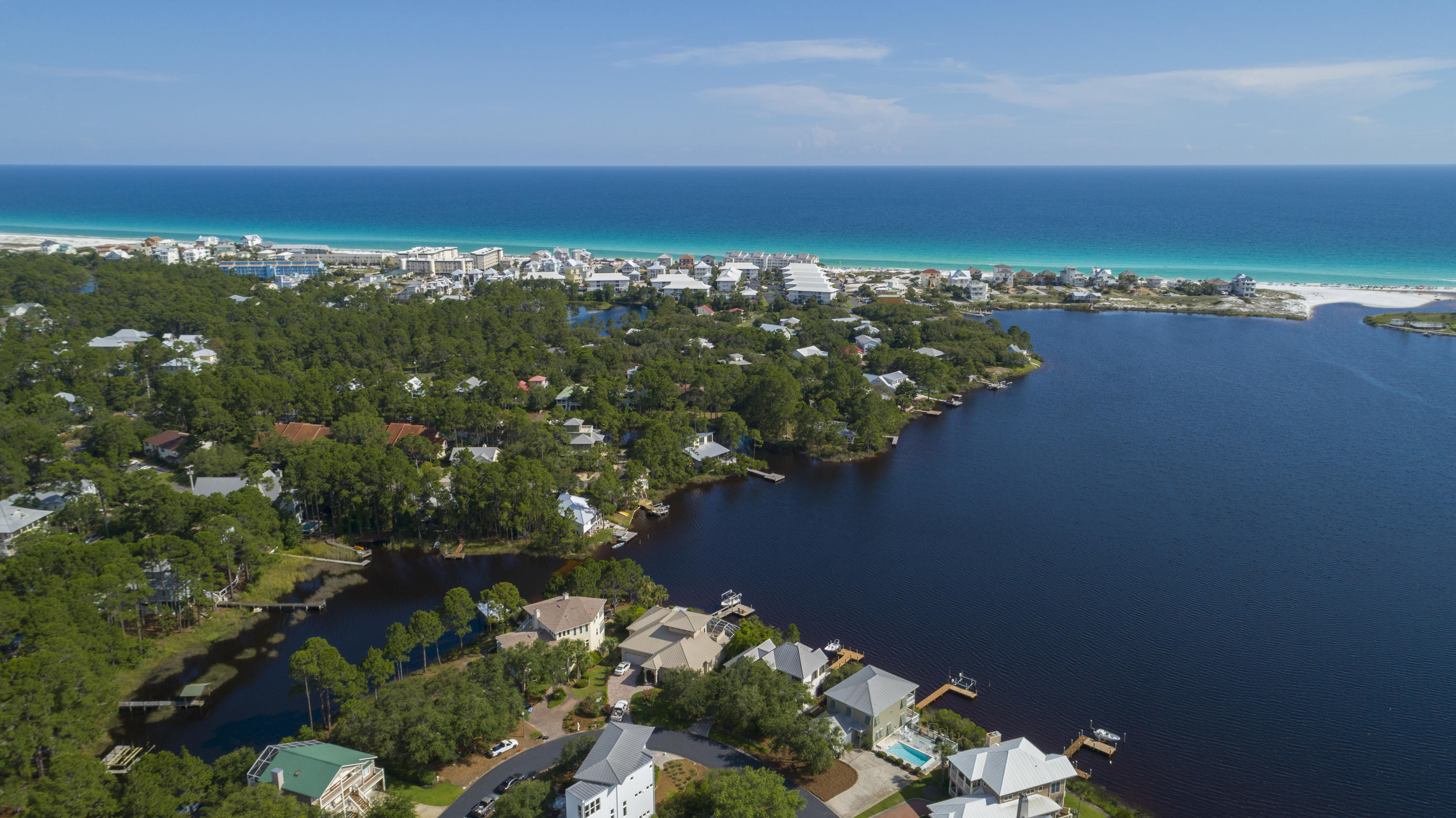 #WAITINGFORTHESUNSET every day! A GREAT LAKEFRONT HOME w/ GULF ACCESS from COASTAL DUNE LAKE on a Cul-de-sac SOUTH 30-A 3/10 MILE FROM THE SECLUDED BEACH!! Modern Home offers PANORAMIC VIEWS OF EASTERN LAKE from almost every room. OPEN LIVING w/ HUGE KITCHEN w/ marble countertops, custom cabinets & 'top of the line' appliances. Home FLOWS seamlessly into DINING AREA with FABULOUS LAKE VIEWS! The white oak distressed floors on first floor. The FIRST FLOOR MASTER SUITE IS PRICELESS, so you can live on one level. Master has a HUGE WALK-IN CLOSET with custom built-ins. The master bathroom has double vanities and a great walk-in shower. LIVE THE LIFE ON EASTERN LAKE WATCHING THE SUNSETS EVERYDAY