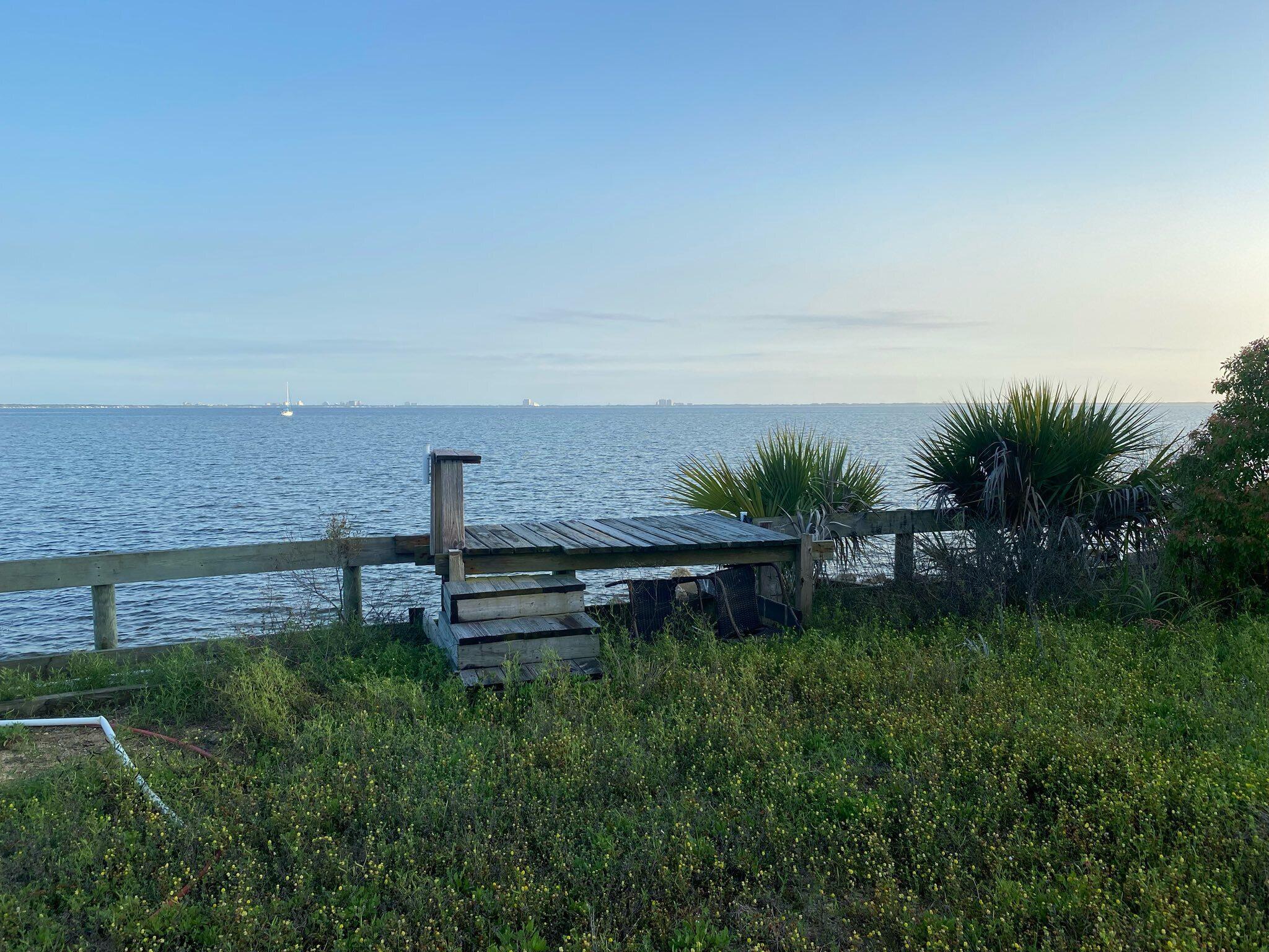 Nearly 0.31 acre bayfront lot and on Hwy 20, is available for your purchase! Capture 180 degree views of spectacular sunrises and sunsets while looking South to the panorama of Destin to Miramar Beach! The Mid-bay Bridge is just a couple of miles to the West to allow you easy access to the beaches of Destin, and its world class shopping! Get the proper permits and build your dream home with amazing views! Walton County Planning and Zoning indicated you could get permitting to have an in-law quarters or to build a duplex with a view (which could not be sold separately, since it is not located on a street corner!) Call to make your offer, today! Cheers