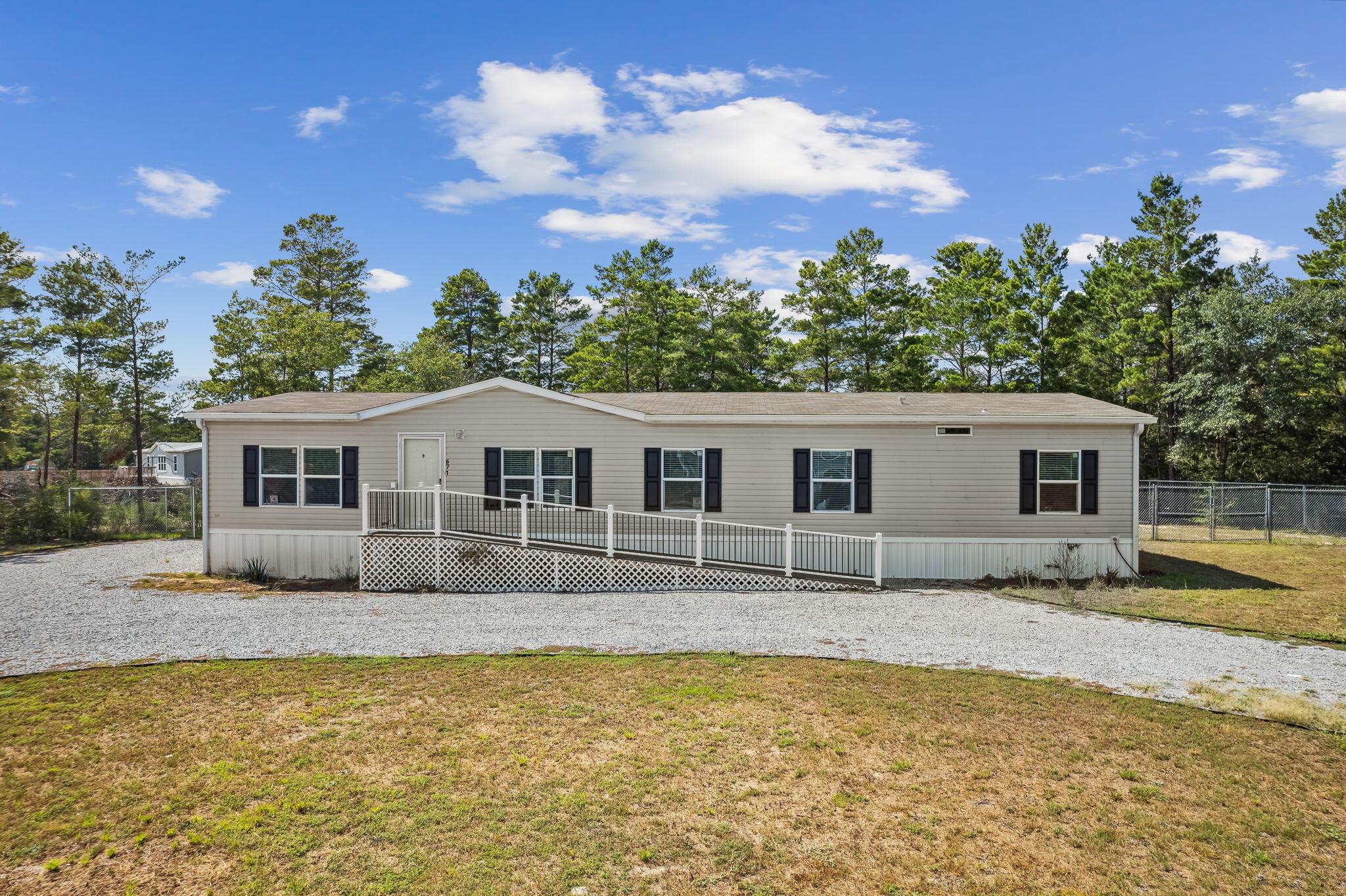 Beautiful Manufactured home features 4 Bedroom, 2 Bathrooms, a large Great Room, a big kitchen built to entertain in with your large center island. Outside you can sit and relax in your screened in porch or host a cookout on your large back porch while your guess enjoy your above ground pool. Built in 2020, situated on 1.2 acres just outside of charming Defuniak Springs. Come enjoy the best of everything Florida has to offer in this little slice of serenity!