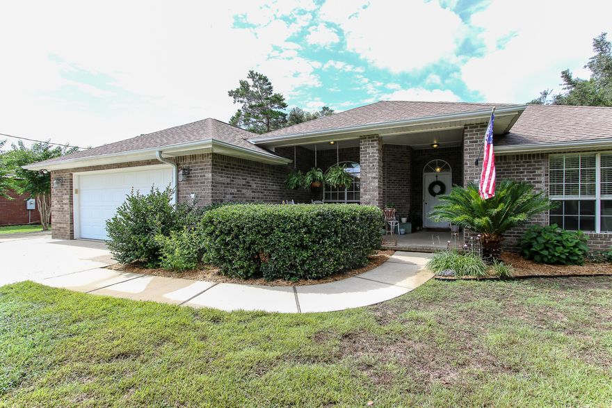 This custom built all brick home in Holley by the Sea is located on a beautiful lot with lots of trees, shrubs, and natural vegetation. The home has been well cared for and has many upgraded features to include new custom countertops. The split bedroom floorplan features a large open family room with cathedral ceilings, a corner fireplace, plant ledges, bull nose corners and knock down texture on the ceiling. This home has a huge kitchen with maple cabinets, stainless steel appliances, and a large breakfast area with a bay window overlooking the back yard.