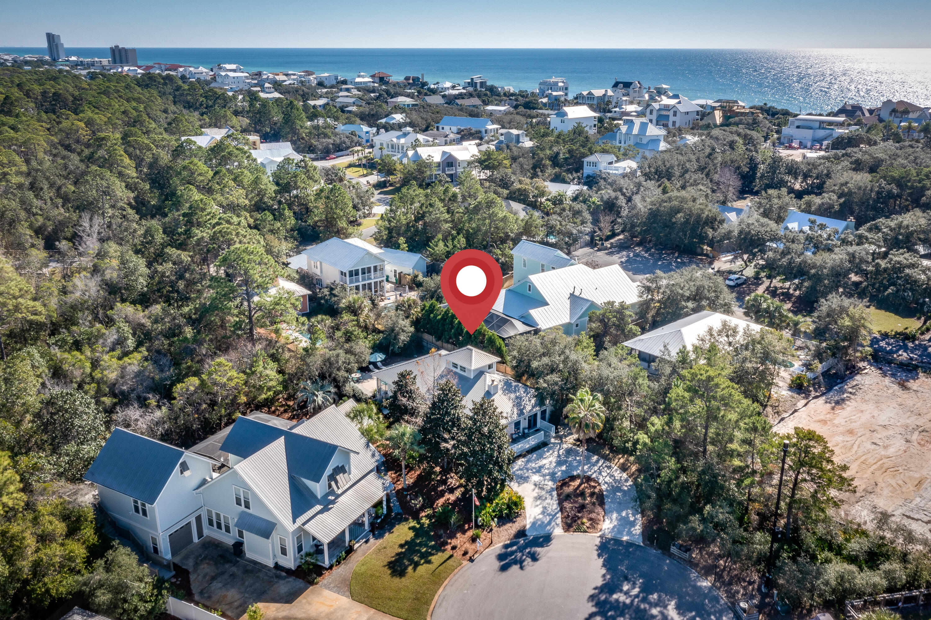 Experience Old Historic Seagrove at its best. Classic Cottage on coveted Suzanne Drive in Seagrove Village. Seagrove Seventh Edition. Premium lot at the end of the street and head of the cul de sac. Easy stroll to the beach with several public access points and beach easements.  Centrally located on 30A. Walk to Seaside, restaurants and even Publix. Charming 3 bedroom with additional loft used as a 4th sleeping area. Large driveway with inviting front porch. Open floor plan. Off the Main living area is a screened dining porch with easy access from the kitchen. Great room boasts a cozy gas fireplace. 2 spacious bedrooms accommodate king sized beds with access to another spacious screened in porch overlooking the pool.