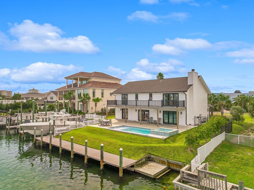 CALLING ALL BOAT LOVERS!! Final renovations completion is underway. Rare opportunity to complete your dream home or rental investment located in the highly sought out Holiday Isle of Destin in between the harbor and Gulf.  4 bedroom 4 bath, Double Master Beach Home could be yours. Brand new 45 ft. 23k lbs. boat lift with 85 ft along the deep water canal that can dock another 60 ft boat. Yes, 2 boats! Brand new salt water pool, new roof, HVAC & hot water heater. Marble Kitchen with all new cabinets and stainless steel appliances, Sub-zero fridge, Wolf Stovetop & Oven and state of the art microwave. The double masters upstairs overlook the Destin Harbor for incredible sunrise views and canal activity. Office upstairs could be perfect for bunk room. Private Beach access.