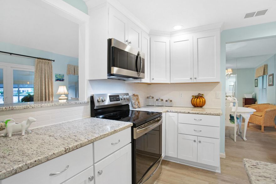 Enjoy a crisp fall afternoon on the private back patio of this lake front property. Upon entering the residence, you are welcomed by the crisp, cool color palette and tall ceilings in the living area. No need to worry about stains in the carpet because there is wood-look ceramic title throughout the home. The kitchen features stainless steel appliances, granite countertops, and ample cabinet space to store all you need to prepare your favorite meals. Enjoy your own private patio off of the Master Bedroom along with a spacious walk-in closet and en-suite bathroom. A personal Golf Cart pad with charging station is conveniently located directly in front of the unit (golf cart not included). Home is being sold partially furnished. Exclusion list in documents. Bayou owners enjoy access to the two heated SOA pools: One across from Linkside Village on Audubon Drive and the newly constructed Phil Hummel Aquatic Center centrally located at the Baytowne Ave Traffic Circle.As an introduction to the Sandestin lifestyle, we invite our new owners to explore amenities that make Sandestin special. The listing brokerage and seller(s) are presenting the buyer(s) of this property with (2) 90-minute rounds of Tennis court time, a golf foursome at one of our three championship courses, and a round of golf for up to four (4) players at the unrivaled Burnt Pine Golf Club.

Sandestin Golf and Beach Resort is a major destination for all seasons and all ages, and has been named the #1 resort on Florida's Emerald Coast. This magical resort spanning over 2,000 acres is comprised of over 70 unique neighborhoods of condominiums, villas, town homes, and estates. The resort features miles of sandy white beaches and pristine bay front, four championship golf courses, a world-class tennis center with 15 courts, 4 resort swimming pools (and 15 private neighborhood pools), a 123-slip marina, a fully equipped and professionally staffed fitness center, meeting spaces and The Village of Baytowne Wharf, a charming pedestrian village with events, shopping, dining, family entertainment and nightlife. For true golf cart community living, Grand Boulevard is just outside the resort gates and provides access to additional shopping, dining and entertainment  all without traveling on Hwy. 98.  Come to Play, Stay for Life!