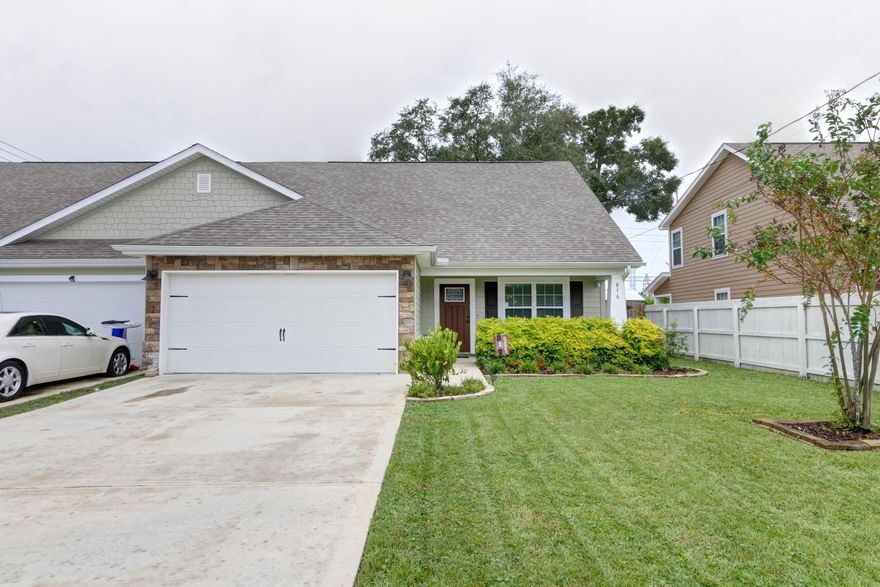Welcome home to this absolutely stunning 5 bedroom, 2.5 bath craftsman style fully updated townhome that's less than 3 years old located in the heart of Fort Walton Beach convenient to Eglin Air Force Base and Hurlburt Field! Fantastic for a primary residence or a rental property, this one has all the space you've been looking for! Pull up in the large driveway and appreciate the well cared for curb appeal, and after passing through the covered front patio you'll enter and love the large tile throughout the common areas. Enjoy a spacious living room open to the fully updated kitchen featuring stainless appliances, granite countertops,  bronze fixtures, pantry, and a hop up bar perfect for entertaining. You'll also find a separate eat in kitchen space with a