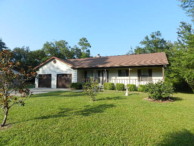 Traditional Style Vinyl-Sided 1340 sq. ft. home. Built in 1995, has 2 bdrms and 1 bath in this East Bayside community. The tranquil setting across the street from East Bay water front homes. Community has a boat ramp, horse stables for boarding and riding, privately owned and operated with access for salt water fishing and fresh water fishing nearby. Home features: extremely large kitchen with great cabinet storage, sunroom, two large bedrooms with shared bath/shower combo. Home features an oversized garage, 30 year dimensional shingles, lawn pump and large back deck. Get away from it all and come to this serene location to enjoy the beauty of the area, the native Florida plants and a laid back lifestyle.