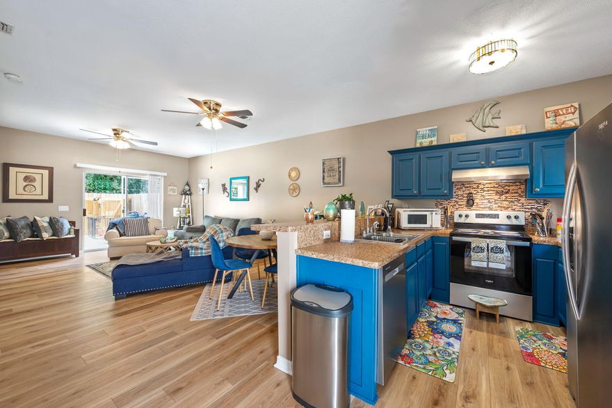 Welcome to your beautifully updated attached single-family home, where beach-inspired living and modern upgrades come together in perfect harmony. This move-in ready gem features all-new luxurious LVP flooring and fresh interior paint throughout, creating a bright and breezy coastal ambiance. The kitchen shines with brand-new stainless steel appliances, freshly painted cabinets, a granite-look countertop, and a generous pantry--perfect for your culinary adventures.Enjoy your mornings with the sunshine streaming through full glass storm doors on both the front and back, and step outside through the sliding glass door onto a charming, fenced-in patio--ideal for relaxing or hosting backyard picnics. A convenient outdoor storage room adds extra space for your beach gear or gardening tools. Upstairs, both bedrooms feature new LVP flooring, while the bathrooms boast elegant marble-look countertops. Multiple closets including extra linen storage provide ample organization solutions. Additional highlights include new ceiling fans, a newer roof (2022), a neutral palette that complements any style, and a private backyard retreat. Located just 6 miles from Navarre Beach and close to Hurlburt Field, shopping, and restaurants, this is coastal living at its best. Garage & storage unit repainted. A 1 car garage and 2 additional parking spaces in the driveway allows for ample parking. HOA maintains the landscaping and termite Bond; New A/C unit in 2024 w/10 yr. warranty. Roof was replaced in 2022! Close distance to restaurants, quick drive to Gulf Breeze and Mary Esther and minutes to the beaches. Garage and storage area recently painted; Don't miss your chance to own this serene and stylish home ,schedule your showing today!