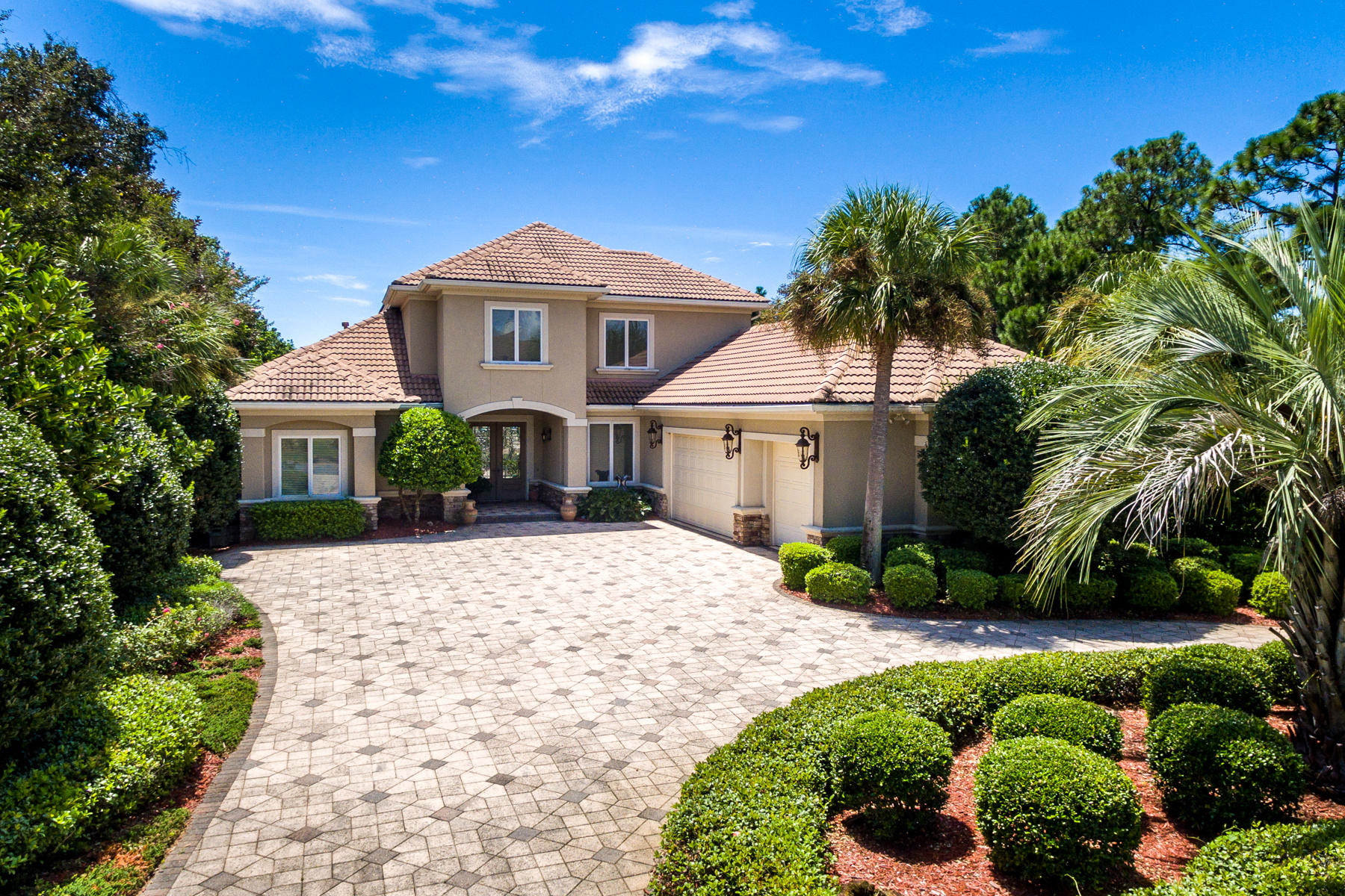 Breathe easy at this peaceful haven in one of Destin's favorite neighborhoods! This elegant and well-planned home makes the most of its tranquil, lakeside setting, allowing the beauty of the surrounding nature and serene lake views to permeate the home with a feeling of relaxation.Sophisticated, yet with a touch of understatement, the home's attractive presentation and wise use of space caters to many lifestyles and offers longevity of enjoyment. With distinct formal living and dining areas and a large, open eat-in kitchen and family room, gatherings of all types are provided for--especially once the sliders are opened to the beautiful, fully enclosed patio with saltwater, heated pool! The kitchen includes a large island, amazing cabinet space, gas cooktop, 2 sinks, and more!