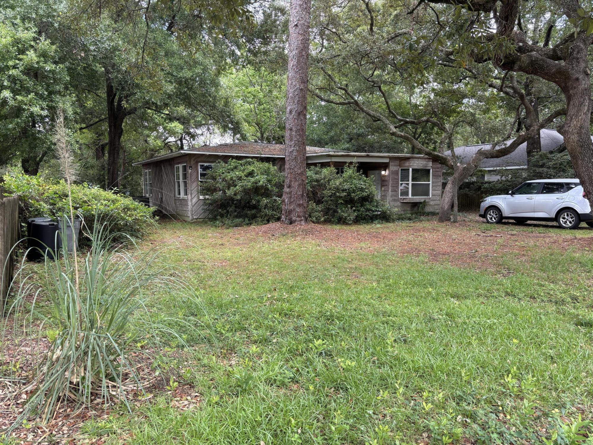 Just across from the water, this cozy 2-bed, 2-bath home sits on a spacious lot with shady oak trees and tons of potential. It features big bay windows, an indoor laundry room with washer and dryer included, and a layout that's easy to make your own. Big-ticket items done-- roof replaced in 2018, HVAC in 2019, and the home appears to have been rewired with copper. Whether you're looking for a primary home, vacation spot, or rental, this one's priced to move.
