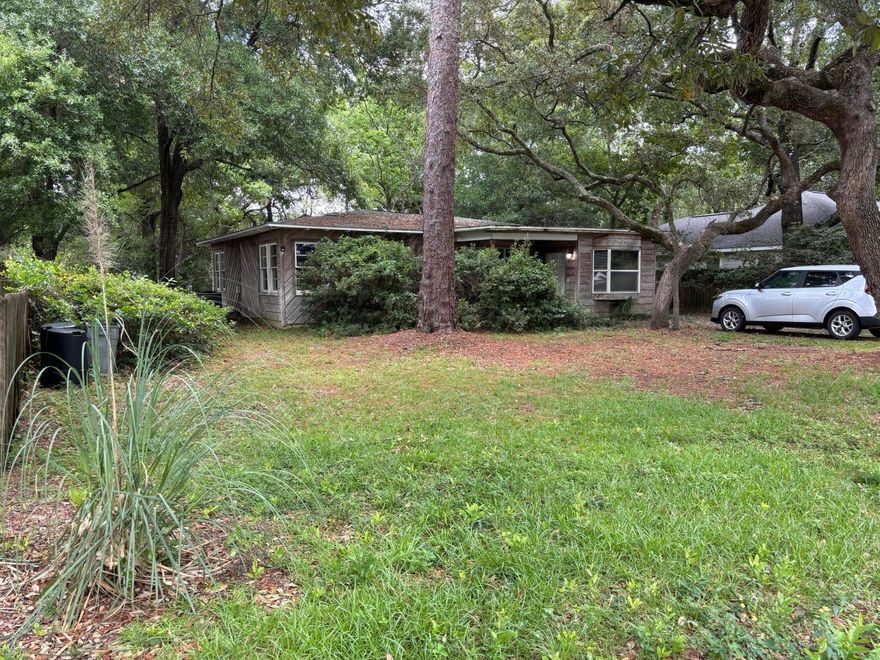 Just across from the water, this cozy 2-bed, 2-bath home sits on a spacious lot with shady oak trees and tons of potential. It features big bay windows, an indoor laundry room with washer and dryer included, and a layout that's easy to make your own. Big-ticket items done-- roof replaced in 2018 and HVAC in 2019. Whether you're looking for a primary home, vacation spot, or rental, this one's priced to move.