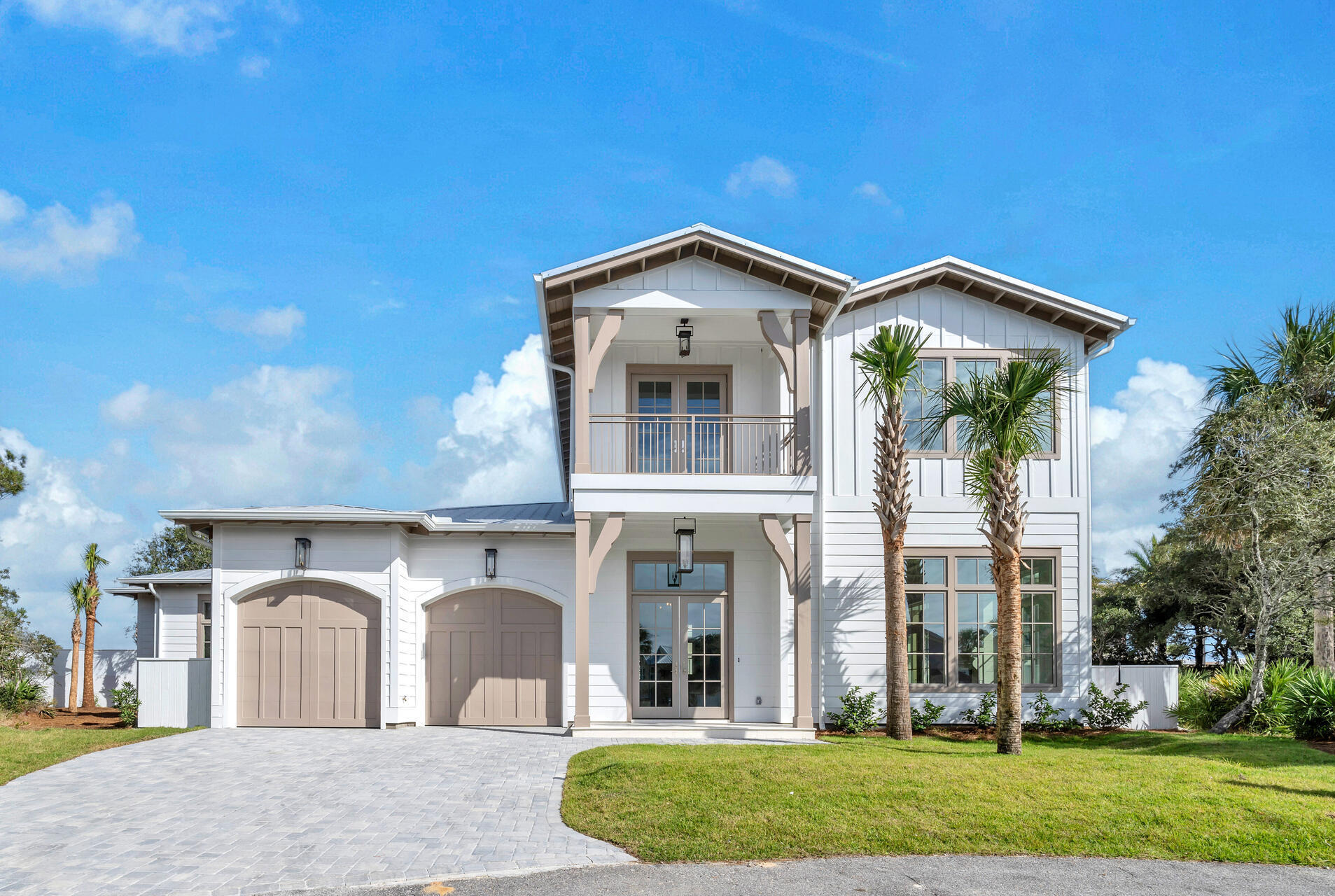 Escape to luxury coastal living in this exceptional new construction house, situated in the sought-after non-rental gated neighborhood of Sand Cliffs. This meticulously crafted home offers exclusive deeded beach access in a serene setting that evokes tranquility and sophistication.Step inside this modern oasis and discover an inviting space perfect for entertaining with a touch of flair. The gourmet kitchen boasts top-of-the-line features including an ice maker and wine fridge, catering to your culinary desires and making hosting a breeze. The main living area features towering coffered ceilings and an open floorplan, fireplace and wire brushed white oak hardwood floors.Nestled on an oversized lot, this property exudes privacy and grandeur, providing ample space for your personal