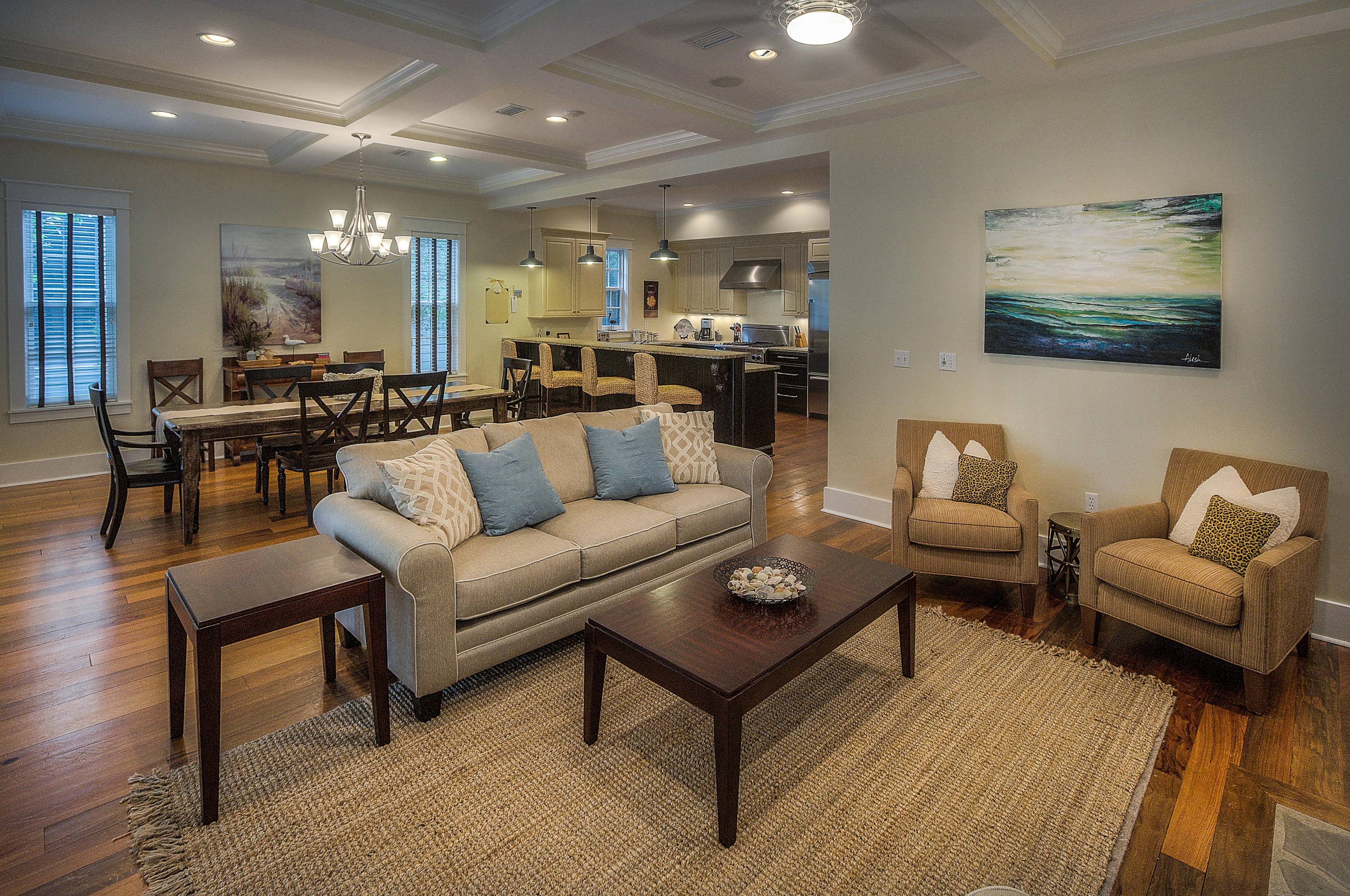 With a desirable location approximately 200 feet from the most popular amenity in WaterColor, it is no wonder this furnished home is projected to gross over $80k in annual rental income. Three sets of French doors lead from the inviting front porch directly into the open concept living areas. The living area and dining areas are spanned by an elegant coffered ceiling accented by crown molding. The living room fireplace and wide cut hardwood floors that carry throughout the home add warm touches that enhance the comfortable atmosphere. The gourmet kitchen features two-tone cabinets, substantial 3cm granite counters, a suite of professional-grade stainless steel appliances, bar seating, and separate wet bar with beverage cooler and ice maker. The master bedroom is conveniently located on the first floor. Its bath features slate floors, a double vanity, free-standing soaking tub and separate shower. The cozy 2nd floor loft provides an additional living space for those staying in the three guest bedrooms to enjoy. Abundant storage found on each floor adds to the year-round livability of this beautifully built Soave Development Group home.