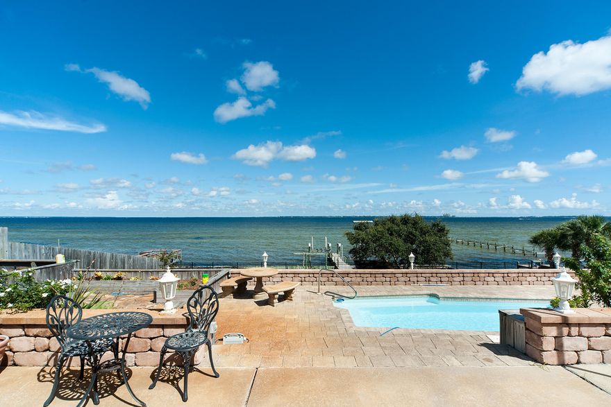 STUNNING Waterfront residence on Choctawhatchee Bay! Enjoy breathtaking views from the expansive, multi-level pool deck. Ideal for entertaining with the kitchen and 2 separate living areas facing the Bay and large pool deck. Interior features include: wine cellar room with custom-glass enclosures, 10' ceilings at ground level, remodeled bathrooms with an extraordinarily large master shower featuring glass enclosures, massive master bedroom closet with custom shelving, & new kitchen appliances. Exterior features: fresh paint, lush landscaping, large drive way with circular drive, 2 car garage, courtyard between garage and house, pool, high elevation, boat dock, and amazing views. 1 Country Club Drive is nestled perfectly at the end of the street for privacy and enjoyment!