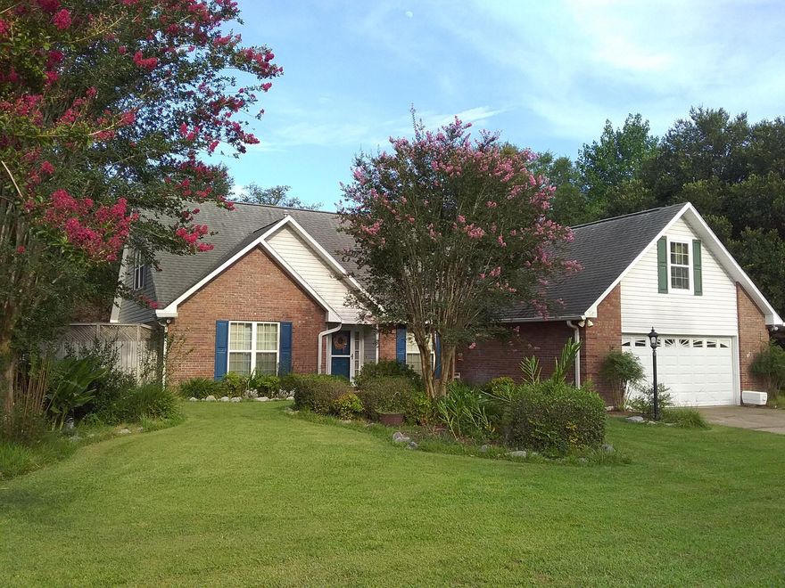 When you make it here, you've made it HOME! This spacious home south of I-10 is spectacular! This gorgeous landscaped lot has a privacy fence, sprinkler system, and power boxes inside the landscaped beds for outdoor lighting! The lot boasts a large covered RV/boat area with concrete pad, 50 amp connection, and roller at the bottom of the gate for ease and convenience of parking. Behind the carport is a separate workshop, complete with workbench & electricity for that power tool enthusiast & late night project hero! Nestled behind the workshop is a lovely fenced garden area with raised flower beds. Along the back yard is a lighted privacy fence providing the perfect setting for entertaining friends and hanging out with family. The gas hook-up is essential for traditional summer grilling!