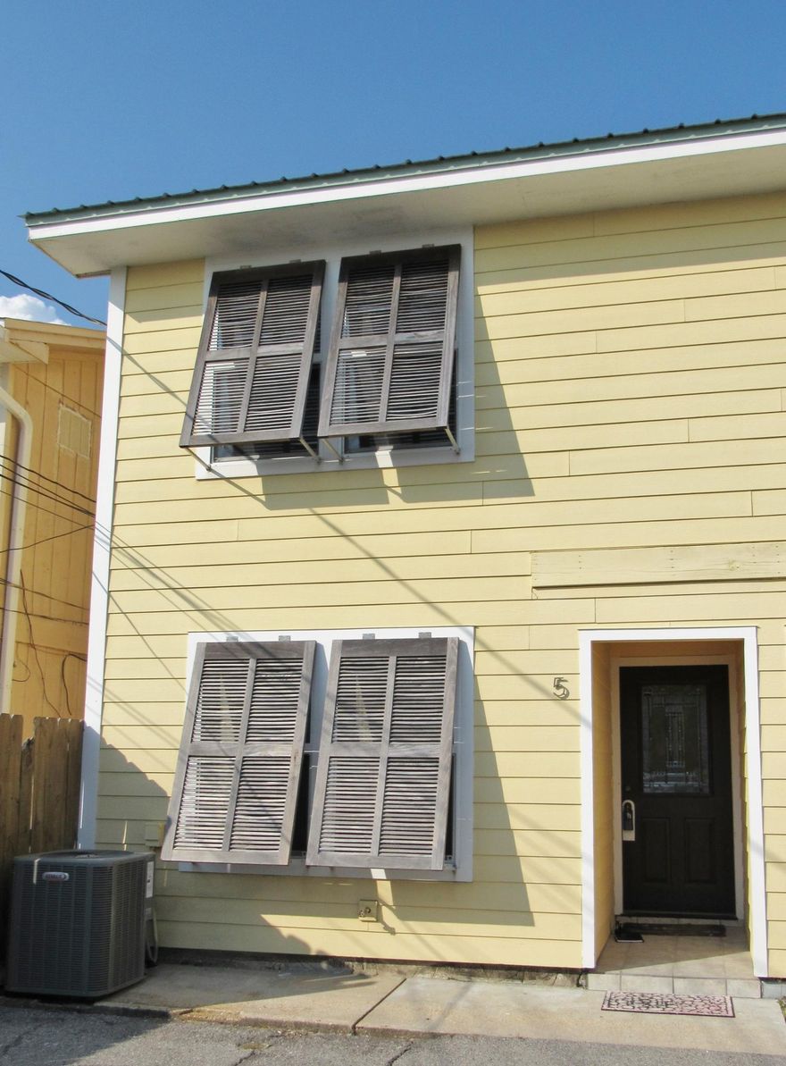 Looking for a spacious end unit town-home recently painted and upgraded on a canal with a 50' boat slip, 35' dock, 10,000 lb. boat lift with additional jet ski lift just 5-10 minutes from the Gulf of Mexico, check out this beauty. The first floor master bedroom offers generous closet space, tiled bathroom and has its own entry to the back deck overlooking the canal. The second bedroom has hard wood floors and its own bathroom. Main floor features an open living and dining area with vaulted ceilings.The main living areas opens up to a massive deck with waterfront views of the Destin Harbor. The updated kitchen features stainless steel appliances, granite counter tops and tile back splash. NO Community HOA just the Master Holiday Isle HOA.