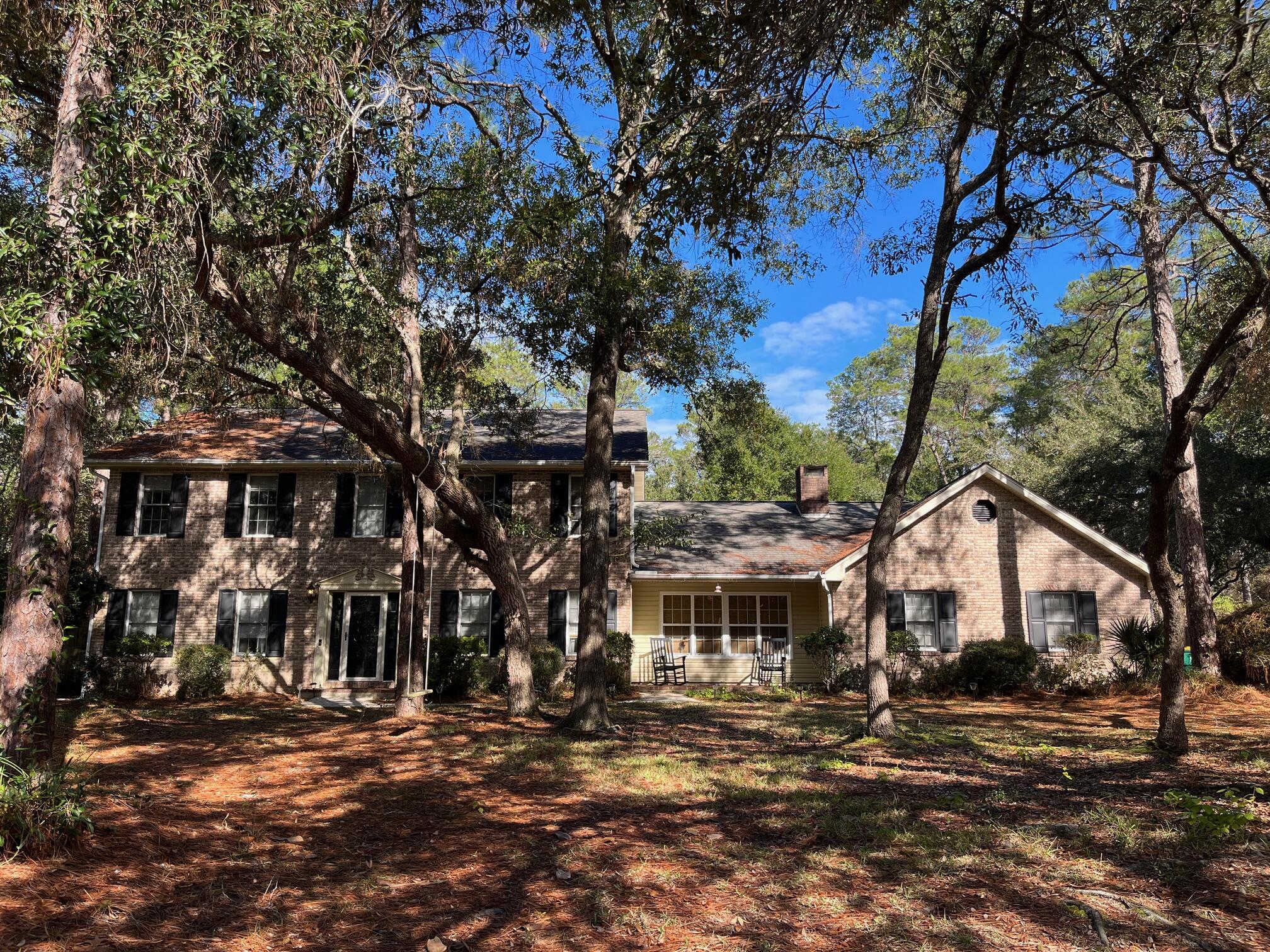 Custom built home with a gunite pool, half-court basketball court and a firepit area on a large .68 acre lot that borders a greenbelt in Rocky Bayou Estates. This traditional ''Williamsburg'' style home was built by Gary Miller and has been impeccably and lovingly updated.  Upon entering this fine home through the 2-story foyer, you will find the living room/den on the left and the large dining room on the right. Through the foyer is the family sized eat-in kitchen overlooking the HUGE back yard. The kitchen was completely updated in 2020 with custom cabinets, upgraded stainless appliances and a huge ''cooks island'' as well as a butler's pantry. Adjoining the kitchen is the charming family room accented by a beamed ceiling and a wood burning fireplace with a wood storage area and hearth