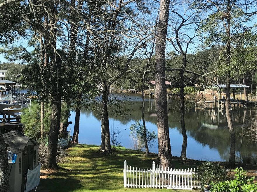 Sprawling views of the bay welcome you into this freshly renovated modern luxury waterfront townhome. Experience dolphins playing in your backyard every morning, gorgeous sunsets over the water in the evenings, and push your kayak right into the water from your backyard. Large fishing hole on the back left, and secluded beach on the back right, plus you have full 24/7 use of the community boat landing. Long-time neighbors with no HOA restrictions on boat storage in the 2+ car garage or 4+ space driveway. Short commute to the base, beautiful emerald beaches, or 30a lifestyle!Two master bedrooms each have large walk-in closet and double vanity bathrooms with glass shower doors. One upstairs room converted into extra-large double closet, easily convertible back to room.