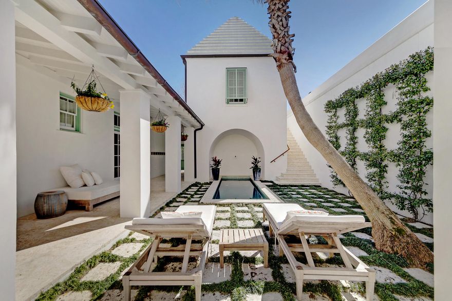 Spectacular Courtyard ''Santigua House'' designed by Gary Justiss. Limestone flooring and stone finishes throughout with spacious areas to gather and relax in the ultimate peaceful surrounding. The master suite, kitchen and living room on the first floor open to the courtyard loggia and pool.