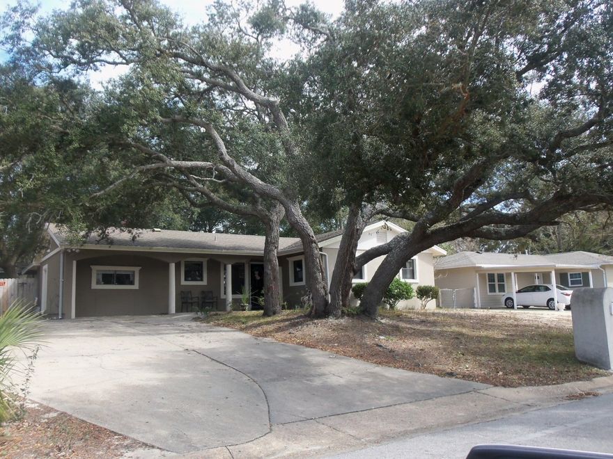 This lovely home was renovated in 2013! Renovations include tile/wood flooring and new cabinets/lighting/copper wiring/electrical panel. It offers a split 4 bedroom plan and 2 full bathrooms. The large privacy-fenced back yard has a covered and open porch area along with a bench seat built around a beautiful, majestic oak tree. A large storage shed is in the corner of the lot. Buyer to verify all information.