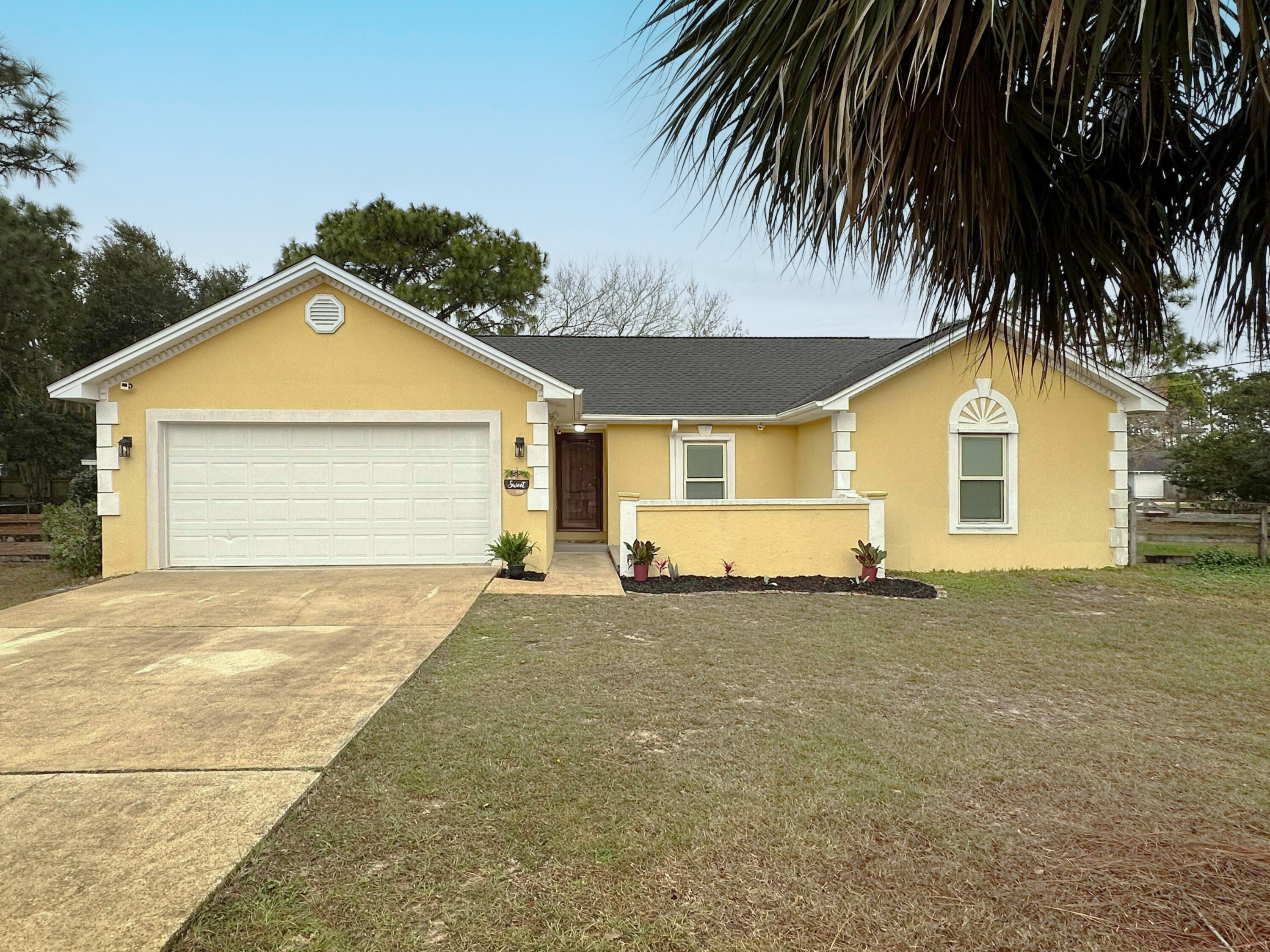 New ROOF with acceptable offer! Navarre's newest stucco HALF ACRE corner lot home! It is near impossible to find such affordable acreage in the desired subdivision of Holley By The Sea! Boasting many features such as front and rear lumber deck patios, garden shed, and fully fenced in grounds, pets will flourish. Inside, you'll love the granite filled kitchen, with tons of natural light pouring in. Vaulted ceilings in the main living space, fresh paint, LVP flooring and organic materials decor all add so much character. Outside the home, enjoy the private beach, rec center, tennis courts, and amenities that HBTS is proud to offer.