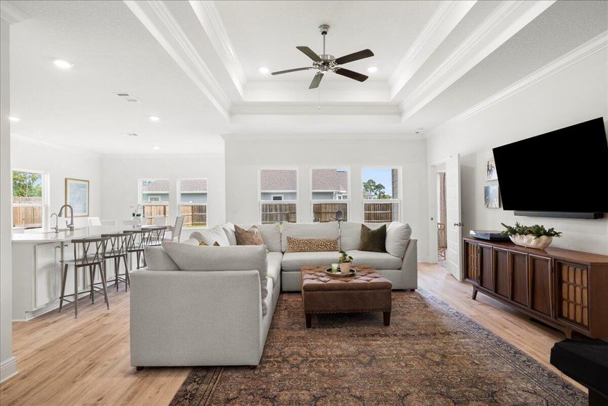 Discover this stunning 2022-built single-story home, just moments away from the Gulf and vibrant 30A. This beautifully maintained 3-bedroom, 2-bathroom home blends modern and coastal elements, offering an open, light-filled layout designed for effortless living. Step inside to soaring ceilings and a seamless flow between the roomy foyer to the gourmet kitchen, elegant dining area and inviting family room - an entertainer's dream and cozy retreat all in one. The chef's kitchen is fully equipped and features a spacious island, LG refrigerator, abundant cabinetry, and pantry. Expansive windows flood the living spaces with natural light, creating an airy, comfortable ambiance.Embrace Florida living on the charming front porch overlooking a newly sodded lawn or retreat to the private, fully-fenced spacious backyard with a covered patio ideal spaces for kids, pets and al fresco gatherings. The spacious primary suite is a serene escape, boasting a tray ceiling, walk-in closet and an en-suite bathroom that has dual vanities, tiled walk-in shower, a soaking tub, and a private water closet offering a relaxing escape at the end of the day. The two additional bedrooms and well-appointed bathroom on the opposite side of the house offer flexibility for family, guests, or a home office set up. The two-car garage with additional storage shelving easily accommodates beach gear and water toys, perfect for coastal living and adventures at the neighborhood's bay access point ideal for kayaking and paddle boards. The home also comes with a home security system, Murphy bed, and a Samsung smart washer and dryer for ultimate convenience. Nestled in a quiet and friendly neighborhood, this home is just minutes from Sacred Heart hospital, 30A Public Beach Accesses, Grand Boulevard's upscale shopping and dining, and Topsail Hill Preserve State Park. Don't miss out on this incredible opportunity for a move-in-ready gem that combines style, function and a prime Santa Rosa Beach location.