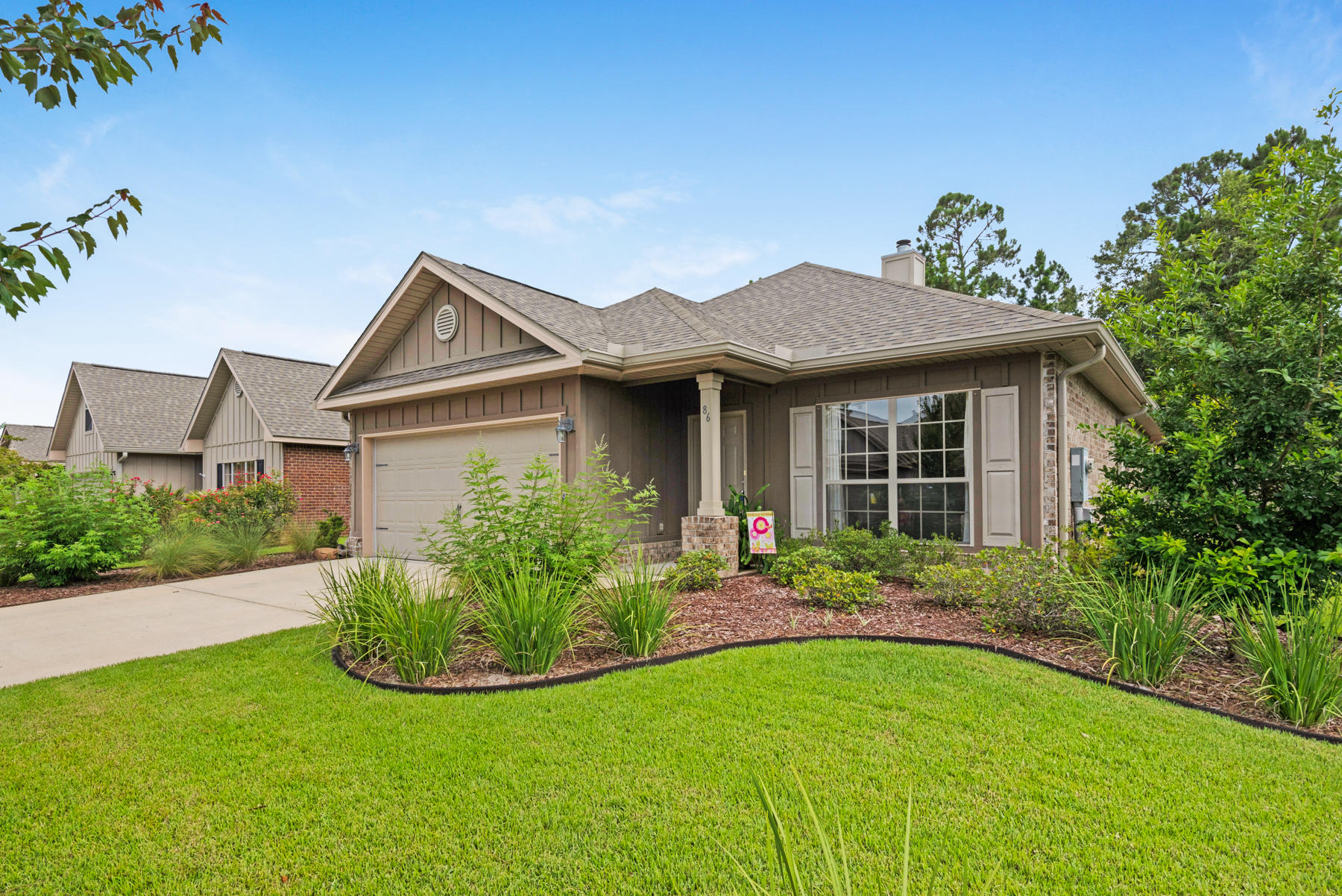 Enjoy the coastal lifestyle in this single story 3 bedroom, 2 bath Craftsman located in the sought after subdivision of Whispering Lakes. The curb appeal invites with lush landscaping, covered entry and Hardie Board exterior. The charm continues on the inside with warm tones, crisp white trim, nine-foot ceilings, crown moulding, wood floors throughout main living space. The kitchen is welcoming with large center island, granite counter tops, stainless steel appliances (Fridge included) and large pantry. This flowing floor plan is perfect for entertaining. The Master suite is very spacious with a large walk-in closet. Master bathroom features huge garden tub with separate large shower with double vanity. The two addition bedrooms are generous in size with ceiling fans and large closets. A