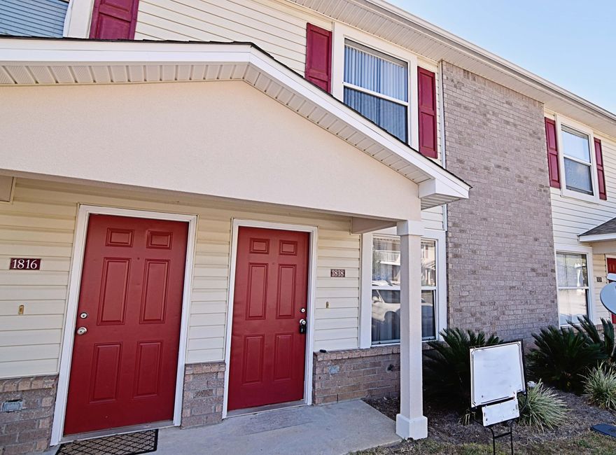 Two story townhome (classified as condo) with pool priced to sell quickly! Great location in Bluewater Bay area close to shopping, dining and medical practices. Living space downstairs has new carpeting in living room and tile throughout the kitchen. Upstairs features two bedrooms with new carpet and two full bathrooms. Convenient half bath downstairs. Refrigerator, washer and dryer convey with unit 'as is.' Patio behind unit is perfect for a grill. Approximate measurements, buyer to verify all information deemed important to include square footage. Units in complex rent for $950 to $1100 per month. New buyer fees include $150 transfer fee plus 0.5% of sales price capital contribution.