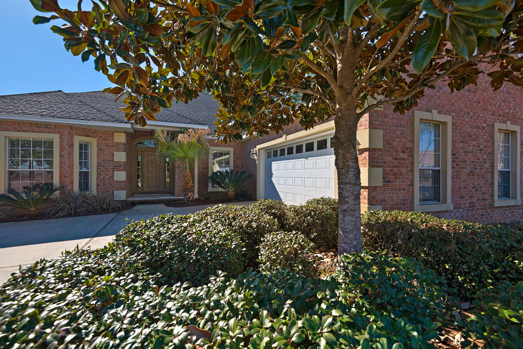 This beautiful one story brick home is on a large level lot and provides great indoor and outdoor living! The living room is very large and open but still cozy with the fireplace, ceiling fan and outdoor view to the large covered porch and back yard. The floorplan is very current with the lovely kitchen and dining area open to the living room. The master suite is roomy, with a walk in closet, and the master bath boasts twin vanities, a garden tub and separate water closet. With 3 more bedrooms there is space for everyone, and one of the extra bedrooms has a full bath, perfect for guests or Grandma. Besides a great golf course the community offers a pool, exercise room and playground. Close to the bay and the beautiful beaches of South Walton, this is a great home awaiting it's next owner.