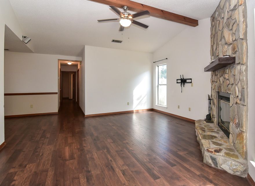 Welcome to Blue Pine Village in Bluewater Bay! What an opportunity to own a 3 bedroom 2 bath home in one of the well sought-after communities in this area. This home offers a comfortable floor-plan, with a nice size lot. As you enter the front door, you are greeted by rich pecan-colored hardwood floors, a beautiful stone-wall fireplace, and wood-beamed vaulted ceilings. There is an expansive eat-in kitchen w/breakfast nook that leads to the screened-in porch outback. The primary bedroom has its own en-suite bath with a walk-in shower and also has a door leading out to the screened-in porch. The other two bedrooms share a hall bathroom. This home is priced to sell fast and will not last long. Don't hesitate and be sure to set your appointment date!