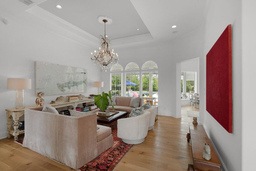 This stunning 3.4-acre estate has been completely transformed by Geoff Chick & Associates. Every aspect of the sprawling 12' ceiling home has been touched, including full interior & exterior painting, gourmet kitchen makeover with 48'' gas Wolf range & custom backsplash, all new marble countertops throughout with waterfall edges on the kitchen island, random width wire-brushed oak flooring, fully remodeled bathrooms, stained cypress tray ceilings and more. This home is a must-see!  The one-level open floor plan offers spacious living that includes oversized bedrooms with walk-in closets, a beautiful enclosed office space with antique reclaimed wrought iron doors, formal sitting & dining room, newly added butlers pantry, a detached carriage house w/ 2 car garage, and new 19' x 38' pool