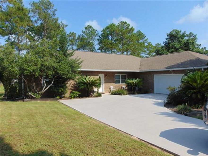This 2002 Custom lakefront home in Ten Lake Estates is a dream as soon as you enter between the two beautiful cedars into this meticulously landscaped yard. 2172 SF custom brick home sits on a 1/2 acre lot with over 125' on the largest lake in Ten Lake Estates. Interior features include open floor plan, solid surface countertops, tile floor throughout; quality laminate flooring in bedrooms; 27x26 garage. Attached workshop is heated & cooled (would also make a great rec room. 12x30 screened Fl room overlooks dock & lake. Included in the sale: all kitchen appliances, Addtl. fridge & all bolted tools in shop; double Adirondack in FL room; boat w/ trolling motor. Energy efficient home with current avg. bill of under $100/mo. This is a definite must see. Schedule your showing today!