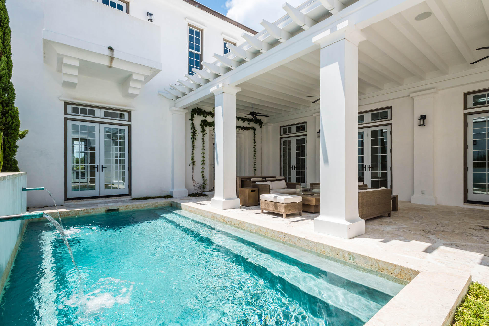 This 3,075 square-foot architectural masterpiece showcases 4 bedrooms + bunk room with 4.5 baths offering soothing natural light throughout the home. A large kitchen with island separates the dining room and living room centered for perfect entertaining. A guest bedroom with ensuite bunk room is located just off the foyer which opens to the very large courtyard showcasing the generous swimming pool. The courtyard loggia is covered allowing for all day usage with lush green landscaping surrounding the pool creating a peaceful setting. Just off the courtyard is a private guest bedroom that is separate from the main house having its own roof terrace above. The second floor is dedicated to the master suite and a 4th bedroom. The master suite captivates Alys Beach architecture to the core