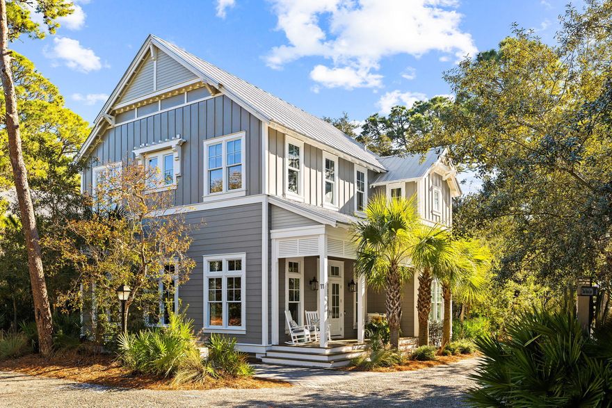 Tucked away in the exclusive Hammocks of Seagrove gated community, this exquisite 4-bedroom, 4.5-bathroom home is a masterpiece of coastal elegance, perfectly positioned for the ultimate 30A lifestyle. From the charming front porch with its welcoming swing to the convenient golf cart garage and additional storage for all your beach and biking needs, every aspect of this home has been thoughtfully designed for comfort and convenience. A mere half-mile from the nearest public beach access, this residence, offered fully furnished, promises the perfect balance between secluded retreat and beachside living.Step inside to discover an expansive open concept living area, where warmth and natural light are amplified by soaring 12-foot ceilings on the first floor.