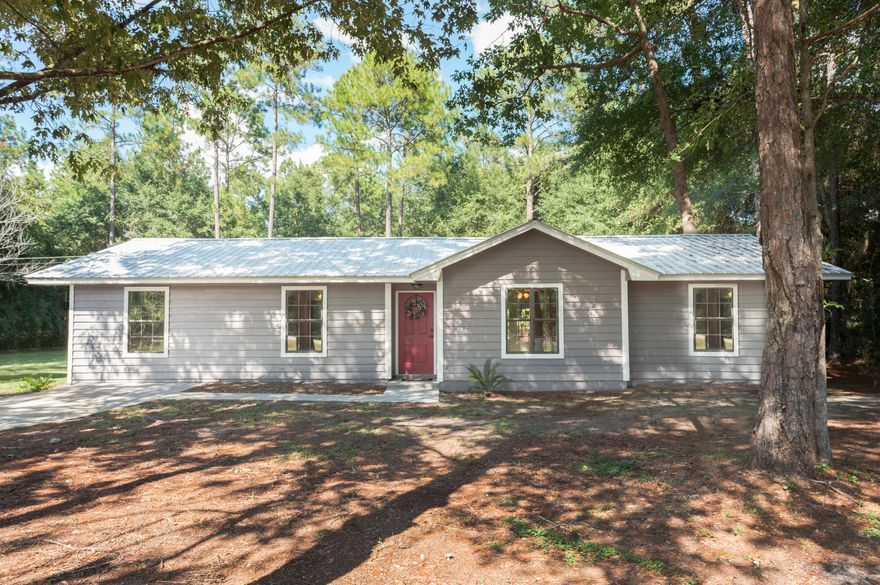 Completely remodeled! This beautifully redone home sits on a large wooded lot in North Crestview. Plenty of space for outdoor recreation and entertaining. It offers a new metal roof, new flooring, paint, cabinets, bathroom vanities, fixtures, and so much more. This is a must see!