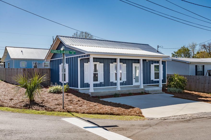 This charming bungalow with great curb appeal is situated south of 98 in rapidly-growing Laguna Beach, midway between the excitement of Pier Park and the relaxation of 30A. The home is thoughtfully designed and makes great use of its cozy floor plan. Hardwood floors and high ceilings throughout the home provide a light, airy feel. The master suite includes a large shower and upgraded fixtures, while the second bedroom is nearly as roomy. The kitchen is well-designed and includes all stainless appliances, quartz counters, and an open design incorporated seamlessly with the living area. Plant your garden or enjoy your pets in the fenced back yard, and relax in the privacy of the sugar-white beach only 1/2-mile away at your own private, deeded beach access.