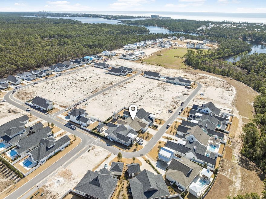 Welcome home! Step into this cozy, thoughtfully designed 4 bedroom, 3 bath home with premium features including 10' ceilings and 8' solid core doors throughout; built by Romair Construction.  Under cabinet lighting in the laundry room and kitchen. Kitchen featuring GE Monogram Integrated appliance package. Quartz countertops with matching riser (backsplash) 36' gas range has never been used. Perfect for entertaining on those beautiful Florida nights with two double doors opening up to the private back yard featuring a cabana with a fireplace, fully fenced with mature landscaping for privacy. Oversized master suite with his and her closets, vanities, and a freestanding soaker tub. This is a second home and has only been stayed in a few times. Home is in immaculate condition and like new.