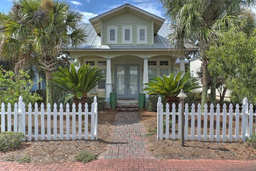 This precious Florida home is nestled in a quiet, peaceful cypress grove in the unique community of Cassine Village. This community has all the amenities of Nature Walk & Watercolor Crossing but is just steps from the beach & first class restaurants & boutique shops. This beautiful, 1 story beach cottage is a rare find. It has quality construction, is well-maintained, beautifully furnished, very nicely landscaped and on a quiet cul-de-sac. It has a very welcoming deep, tiled front porch. The main living area is very open, has high ceilings, tile floors, crown molding, 8 foot tall doorways, and lots of large, sunny transom windows. The kitchen has been updated with a large granite breakfast bar, maple cabinetry, a pantry and stainless steel appliances. It is perfect for entertaining a