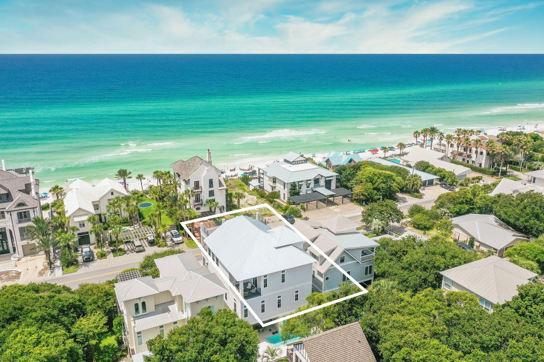 Located just east of Seaside, this professionally-decorated and fully-furnished beach home features 4,391 sqft of living space, a private heated pool, an attached garage, a private elevator and inspiring views of the Gulf of Mexico. An ideal investment property or vacation home, this coastal retreat is conveniently situated one row off the gulf, and access to the beach is just across the street from this residence.With three floors of living space, interior features include hand screen-printed wallpaper, custom tile in the bathrooms, unique light fixtures throughout, and a spiral staircase that leads to a rooftop deck with spectacular views. The first floor offers an entertainment area, wet bar, a guest room with built-in bunks and private bathroom.