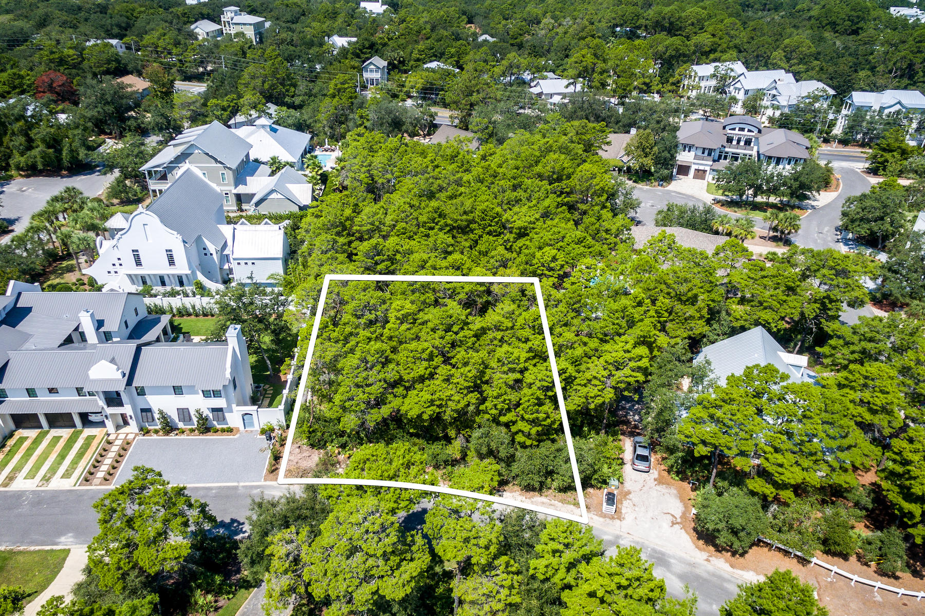 One of the Largest Homesites available in Old Seagrove, a generous .25 acres approx. 100' x 120' allows ample room for your dream home with guest house, garage and pool. Neighboring home values at $2.5 mil+. The property is approximately 23' above sea level and is three blocks off the beautiful Gulf of Mexico beaches. Paved road, no HOA or build out time. One of the last remaining large vacant lots in Seagrove Village. Pedestrian easement takes you to the Azalea Street public beach access and Hwy. 395 public beach access. A 1/2 mile to both Watercolor Crossings, and Seaside. Buyer to verify all information and dimensions.