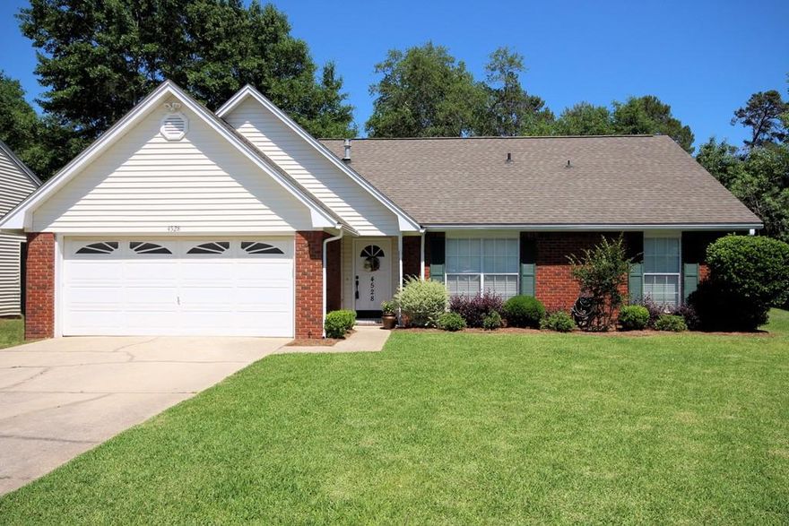 COMPLETELY UPDATED HOME in the Parkwood Lane neighborhood located between Bluewater Bay Elementary School and the Merchants Walk shopping center. Close to schools and shopping, this low maintenance brick and vinyl home has a fully fenced yard and a sprinkler system on a well pump. The floorplan of this home will work for almost anyone with 4 bedrooms and 3 separate living areas! Upon entering this home, you will immediately notice the hardwood flooring and updated fixtures that make this home feel like NEW. The formal dining room is to the right of the foyer and a large family room with vaulted ceiling in front of you. Beyond that, you will find an office accented by barn doors that gives you that ''extra'' living space everyone needs! The renovated kitchen, just off of the family room features new cabinets, counters, granite counters, a farm sink and stainless appliances. The downstairs master bedroom suite offers a large closet and the renovated master bath has two vanities, a garden tub, shower and tiled floors. In addition to the master, there is another bedroom and full bath downstairs. Upstairs you will find two additional bedrooms separated by a convenient loft as well as another full bath. Outside is as wonderful as the inside of this home.  The back yard with plenty of room for kids and pets is accented by a paver patio covered by a charming pergola. This home is ''turn key'' ready and waiting for you. It just doesn't get better than this so make an appointment to see this home soon, it definitely will NOT last long...