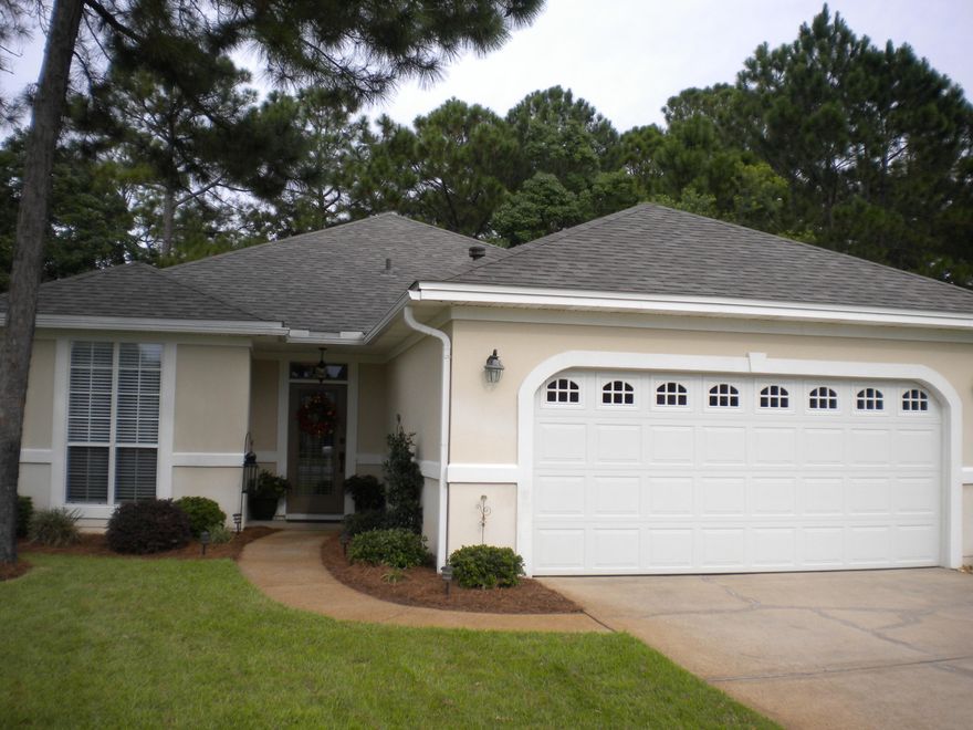 This one will surprise you! Immaculate and ready to sell. Open floor plan with really nice upgrades including granite in kitchen, newer cabinet doors & appliances, New roof 4-16, New Heating & A/C 4-2016. Private rear yard, screened porch, 2-car garage. Nice colors. Fireplace Beautifully landscaped with lemon, pear and satsuma trees. Automatic sprinkler on well. Neighborhood pool, tennis, pavilion and bay front dock. See it today...