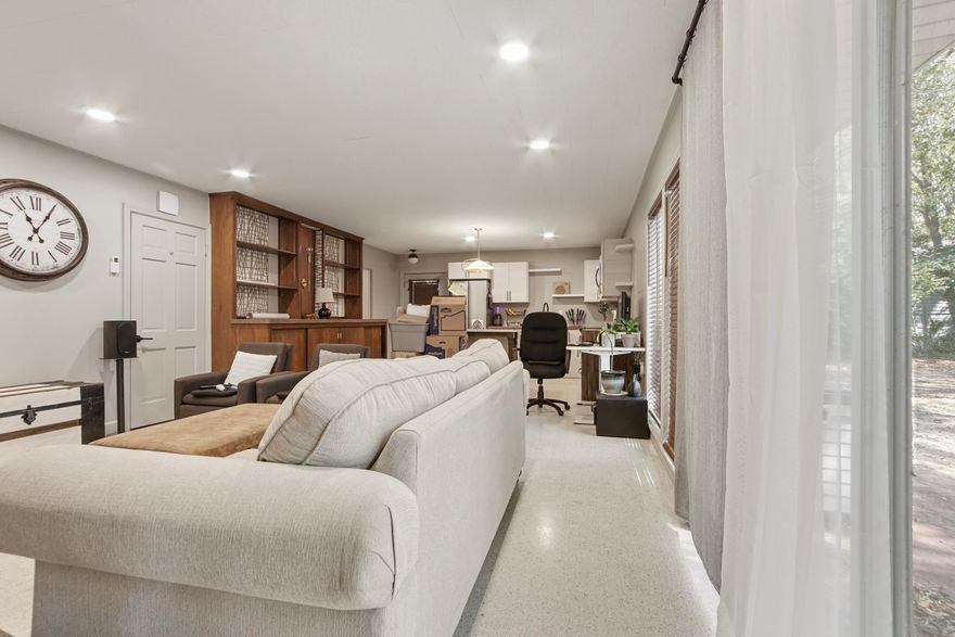 Stunning mid-century studio that has just become available in the heart of downtown. This charming 810 sq. ft. studio boasts new appliances, including a washer and dryer, and features beautiful new cabinets with butcher block countertops. The terrazzo and tile floors add a touch of elegance, while the tile shower offers a modern feel. You'll also enjoy a back patio and a partially fenced yard, perfect for relaxing or entertaining. Located close to the lake and a variety of restaurants, this property offers the perfect blend of convenience and style.