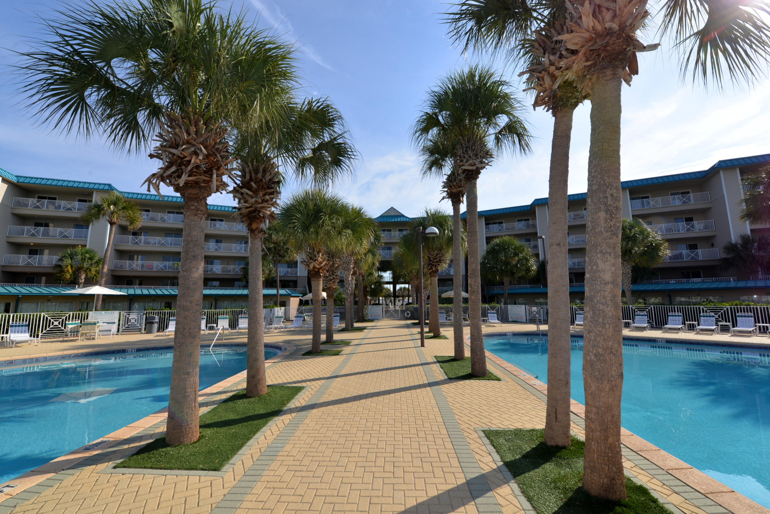 MOTIVATED SELLERS! COASTAL CHIC two bedroom, two bath unit with hall bunks is convenient to the beach & pool. Best parking space in the building - right in front of the elevator! Well cared for - this condo is fresh, clean, & ready for you. Nicely furnished with brand new linens. Flooring is tile with carpet in only the bedrooms. Cheerful all white kitchen with pantry & breakfast bar. Huge utility room with full-sized washer & dryer plus plenty of room for all your beach accessories. In addition, this immaculate unit is actually on the second level of the building. The first level houses the parking garage so you aren't on the first floor! Take in the gulf breeze and enjoy your favorite beverage while on the large balcony. Amalfi has it all including elevators!