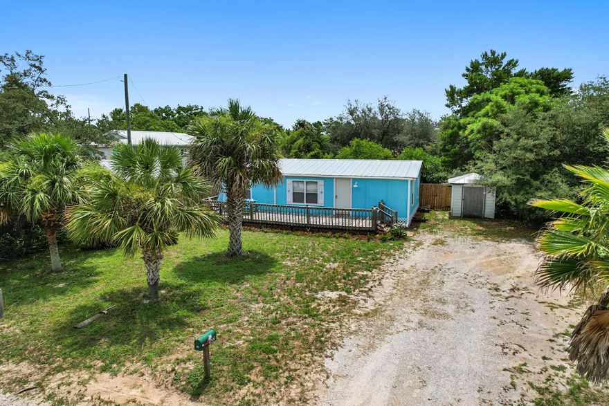 A great second home or a beach retreat! Just a few minutes to the gulf and a short drive to the airport. You can find Pier Park just 6 minutes to the East or head West 10 minutes to the Coastal Scenic Hwy 30A. Large lot loaded with gorgeous fruit trees. Backyard enclosed by privacy fence, plenty of room for your toys, dogs or chickens!This mobile home was taken down to the studs and rebuilt in 2019. Ductless AC system. No carpet, easy to maintain. Newer appliances. Spacious front deck and backyard offer ample outdoor living space.