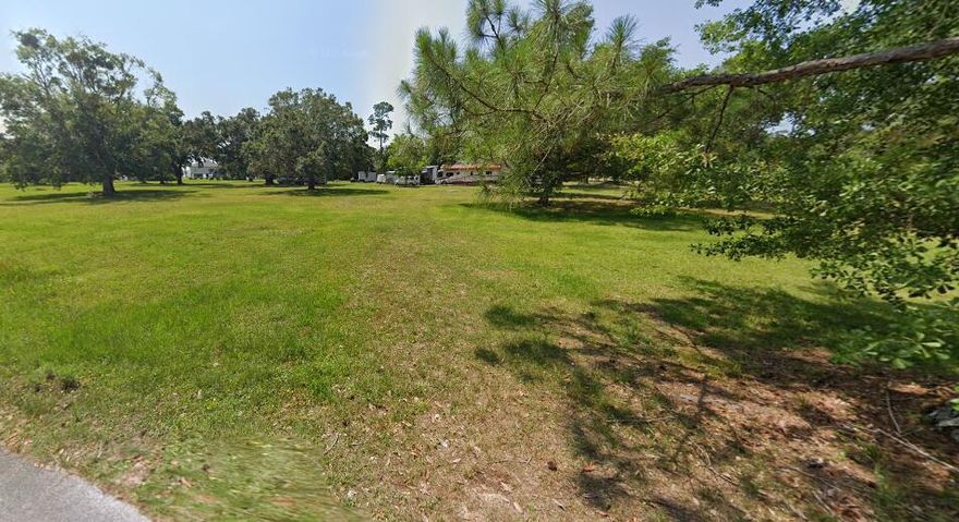 This 0.37-acre cleared corner lot, located at the intersection of Owensville Road and Robinson Point Road, is cleared and ready for building. Just steps from Blackwater Bay, enjoy convenient access to boating, fishing, and other water activities. The property is approximately 10 minutes from I-10, 15 minutes from downtown Milton, and about 20-25 minutes from Pensacola and Gulf Coast beaches. Survey has been done and available on request. No HOA fees. Located in Flood Zone AE. Don't miss this opportunity to own land in a prime location with easy access to surrounding amenities.