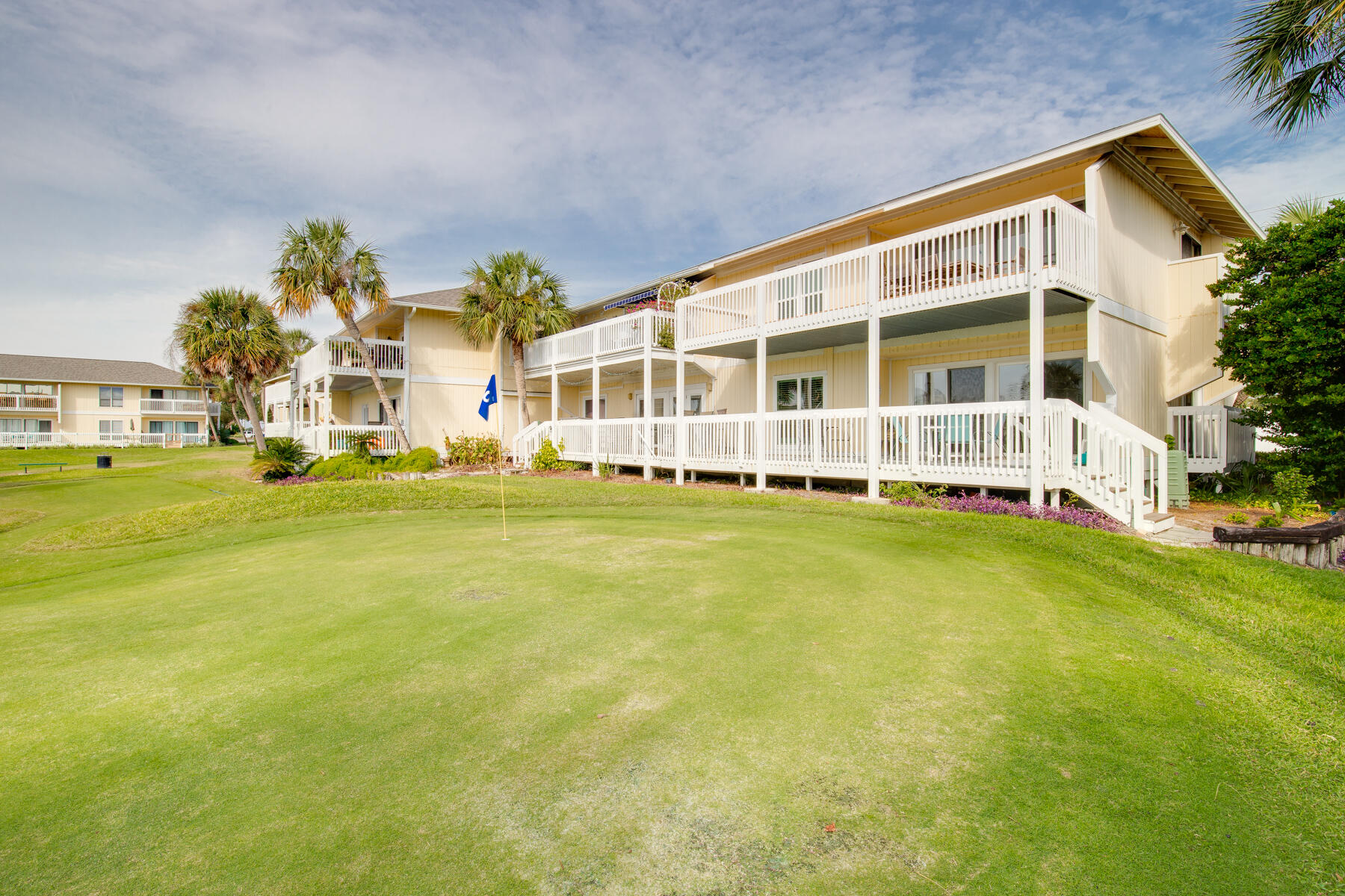 This Open Concept condo has been designed to exude warmth with its outstanding light level throughout, and very pleasing view from the 250 Sq. Ft. Balcony overlooking green space, golf holes and the sparkling pool located less than 50 steps away! Discover the easy access the unit has being located on the bottom level with plenty of parking space. At the front door you will realize how well this property has been cared for with a high-quality exterior glass door upgrade being only the starting point for the many other thoughtful enhancements that include: White Ash Flooring. Granite Countertops, Beveled Trimmed Mirrors, Wainscoted Service Bar, Beautiful Master Bathroom Upgrade, & TREX Decking on the Large Balcony. Come see it today, make it yours, and ''Love it Forever''!