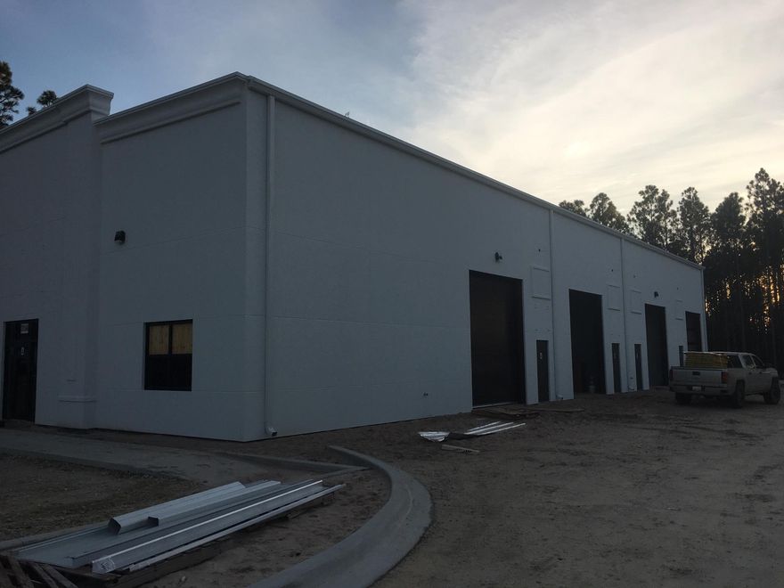 Brand New Office / Warehouse space in South Walton Commerce Park. Roll up door, 24' ceiling heights, store, building and road frontage. Two Bathrooms, Power roll up door, will be Heated and cooled!