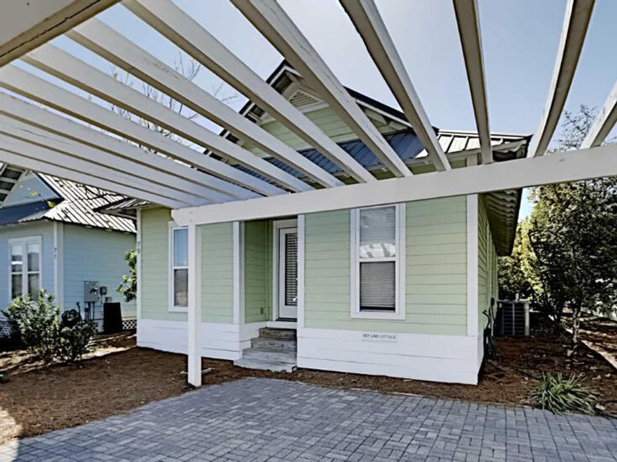 Escape to the charm of 30A and enjoy a relaxing beach retreat at Key Lime Cottage. Located just 200 yards from the Gulf, this cheerful, coastal getaway is the perfect place to unwind, recharge, and enjoy the best of Scenic 30A. You'll spot the cottage right away by its signature bright lime exterior--hence the name! A classic white pergola greets you at the entrance, setting the tone for the laid-back beach vibes that await inside. With three bedrooms and two full baths, this 1,068 sq ft cottage comfortably sleeps six--ideal for families or small groups looking for a peaceful escape. Inside, the open floor plan makes the most of the space with a light-filled living area, cozy dining space, and a fully equipped kitchen featuring stainless steel appliances. It's the kind of place where you can cook up a casual breakfast before heading out for a day in the sunor wind down after dinner with a movie and board games. The Cottages at Camp Creek is a quiet, family-friendly neighborhood full of Old Florida charm. After a fun day at the beach, take a refreshing dip in the community pool, or explore the nearby bike trails, boutiques, and restaurants that make 30A so special. Buyer to verify all dimensions.

